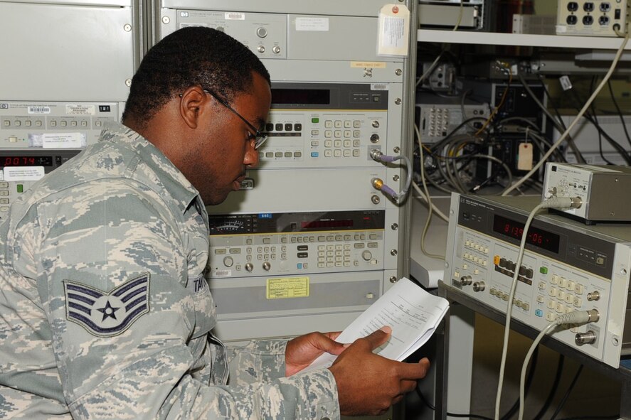 SEYMOUR JOHNSON AIR FORCE BASE, N.C. -- Staff Sgt. Michael Taylor reviews a technical order on how to calibrate measurement diagnostic equipment here July 8, 2010. Newly assigned Airmen go through 12 months of on-the-job training before being awarded their five-skill level. Sergeant Taylor is assigned to the 4th Component Maintenance Squadron as a test measurement and diagnostic equipment technician, and hails from Atlanta. (U.S. Air Force photo/Senior Airman Gino Reyes)