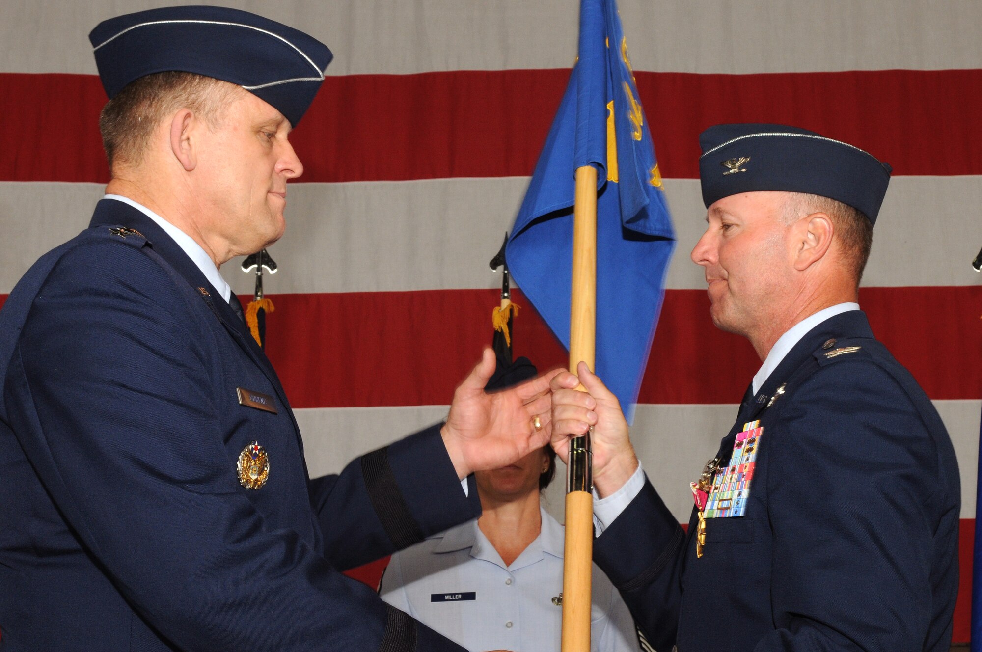 SPANGDAHLEM AIR BASE, Germany -- Col. Tip Wight, former 52nd Fighter Wing commander, relinquishes command of the 52nd FW by handing the unit’s guidon to Lt. Gen.  Frank Gorenc, 3rd Air Force commander.  Command of the unit of more than 5,500 Airmen was given to Col. Christopher Weggeman.  (U.S. Air Force photo/Staff Sgt. Logan Tuttle)