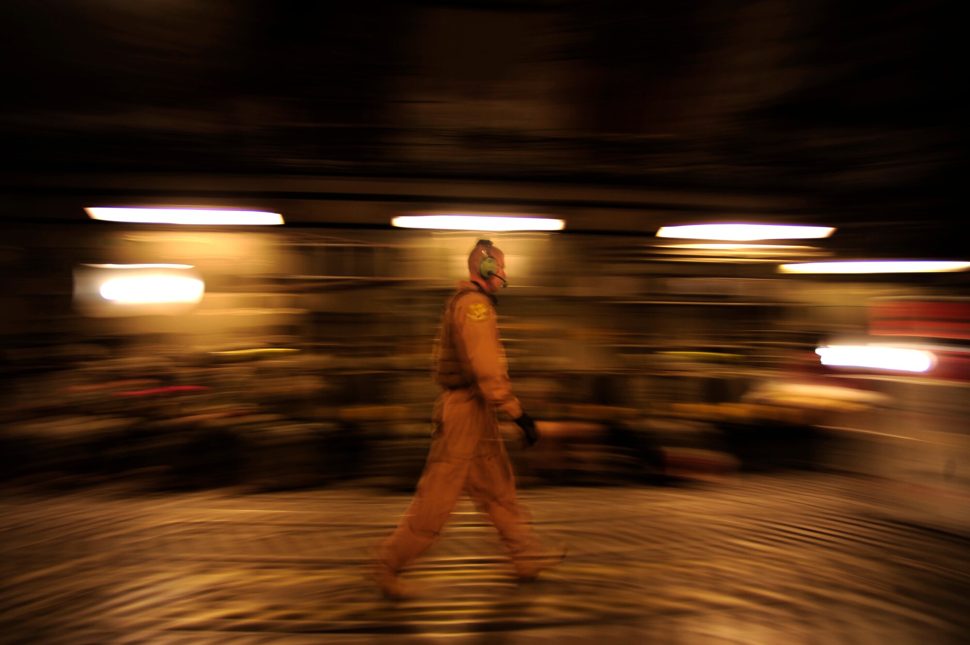 U.S. Air Force Airman First Class, Brian Whitcomb, a C-17 Globemaster III loadmaster assigned to the 816th Expeditionary Airlift Squadron, walks through the cargo bay during a flying mission to Baghdad, Iraq, from an undisclosed location in Southwest Asia on July 6, 2010. (U.S. Air Force photo by Staff Sgt. Andy M. Kin / Released)