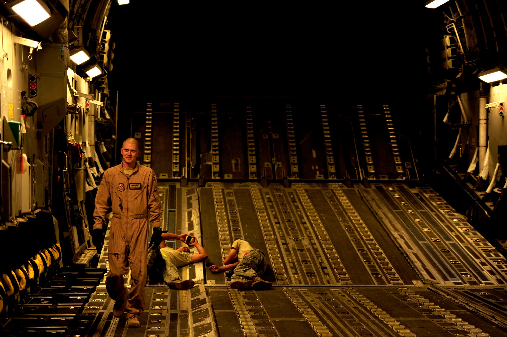 U.S. Air Force Airman First Class, Brian Whitcomb, a C-17 Globemaster III loadmaster assigned to the 816th Expeditionary Airlift Squadron, goes over his pre-flight inspections prior to a flying mission to Baghdad, Iraq, from an undisclosed location in Southwest Asia on July 6, 2010. (U.S. Air Force photo by Staff Sgt. Andy M. Kin / Released)