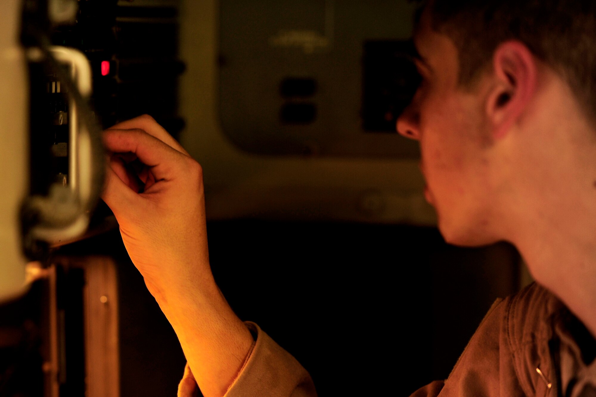 U.S. Air Force Airman First Class, Tyler Hertzog, a C-17 Globemaster III loadmaster assigned to the 816th Expeditionary Airlift Squadron, goes over his pre-flight inspection checklist before a flying mission to Baghdad, Iraq, while deployed to an undisclosed location in Southwest Asia on July 6, 2010.  (U.S. Air Force photo by Staff Sgt. Andy M. Kin / Released)