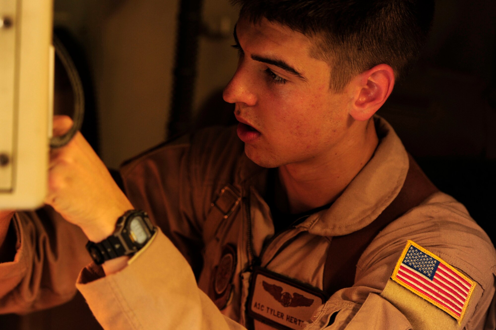 U.S. Air Force Airman First Class, Tyler Hertzog, a C-17 Globemaster III loadmaster assigned to the 816th Expeditionary Airlift Squadron, performs pre-flight inspections prior to takeoff to Baghdad, Iraq, while deployed to an undisclosed location in Southwest Asia on July 6, 2010. (U.S. Air Force photo by Staff Sgt. Andy M. Kin / Released)