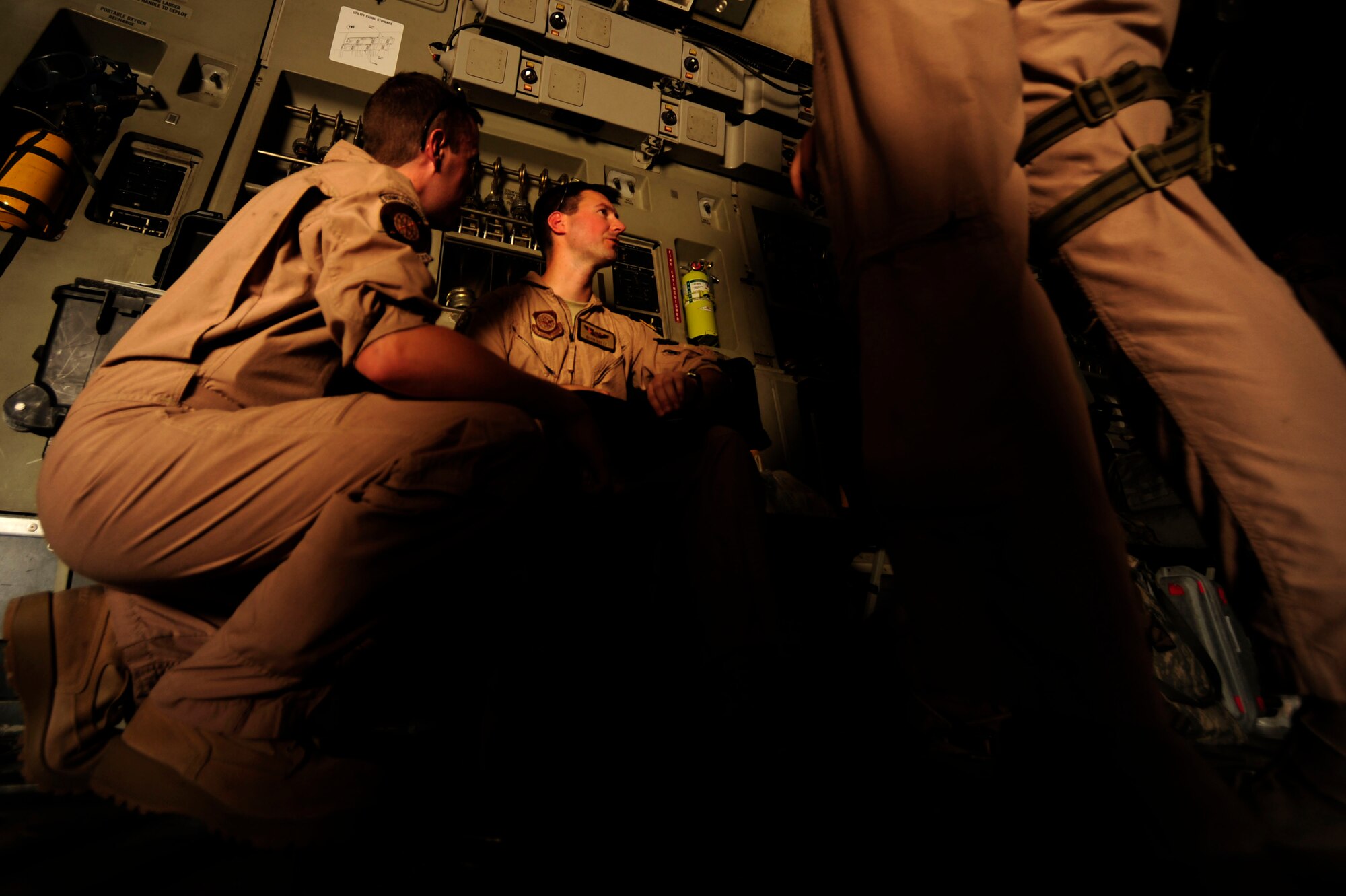 U.S. Air Force Capt. Kevin Kretz, a C-17 Globemaster III pilot assigned to the 816 Expeditionary Airlift Squadron,  briefs his crew during pre-flight inspections while deployed to an undisclosed location in Southwest Asia on July 6, 2010. (U.S. Air Force photo by Staff Sgt. Andy M. Kin / Released)