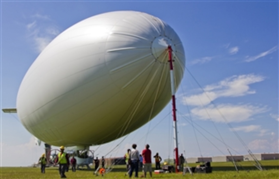 A U.S. Navy MZ-3A manned airship, Advanced Airship Flying Laboratory, derived from the commercial A-170 series blimp, lands at Lake Front Airport in New Orleans, La., to provide logistical support for the Deepwater Horizon Response Unified Command and the Gulf of Mexico oil spill on July 8, 2010.  The Coast Guard requested the support of the Navy vehicle to help detect oil, direct skimming vessels and look for wildlife that may be threatened by oil.  