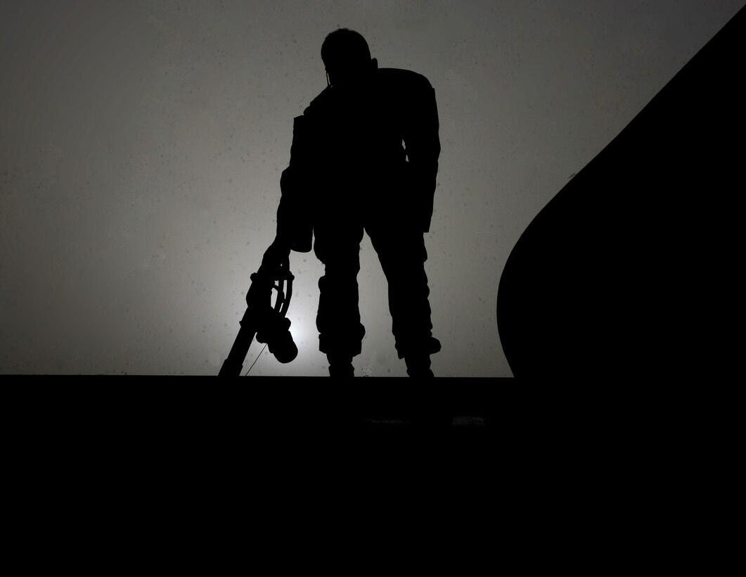 A motor transportation operator with Alpha Company, Combat Logistics Battalion 6, 1st Marine Logistics Group (Forward), preps a tanker to distribute fuel at Combat Outpost Nolay, July 13. A combat logistics patrol numbering more than three dozen vehicles arrived with fuel and communications and computer equipment after nearly two days of crawling through improvised explosive device-laden desert. The gear will enable American forces in Helmand’s volatile Sangin district to establish their own combat operations center and increase the general livability at the growing base.