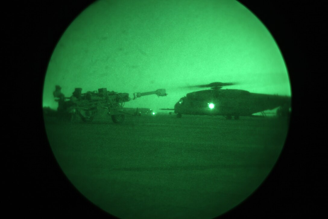 A CH-53E Super Stallion prepares to lift an M777 Lightweight Towed Howitzer with the assistance of a helicopter support team (not shown), Headquarters and Service Company, 1st Marine Logistics Group (Forward) aboard Camp Bastion, Helmand province, Afghanistan, July 13, 2010. HSTs are tasked with assisting heavy lift operations in support of the International Security Assistance Force.