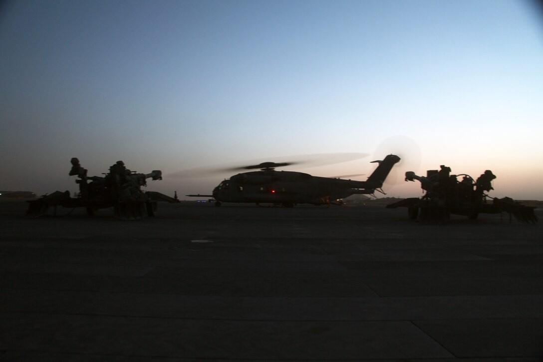 A pair of M777 Lightweight Towed Howitzer cannons are staged waiting to be lifted by a CH-53E Super Stallion out of Camp Bastion, Helmand province, Afghanistan, July 13, 2010. The M777 is a new lightweight towed artillery piece that is deployed in support of the International Security Assistance Force.