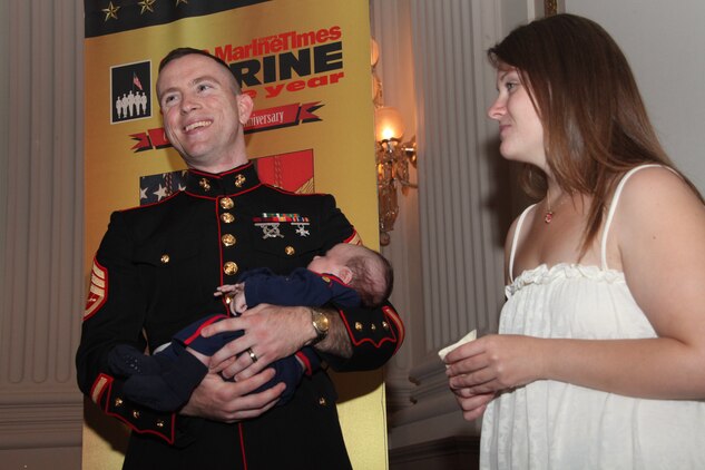 Staff Sgt. David E. Vogt III, the Military Times Marine of the Year, shares a laugh with his wife, Alicia, and his newborn son, Joseph, before a ceremony in Washington recognizing five exemplary service members July 14, 2010. Vogt, a 25-year-old Lakeland, Fla., native, had 23 family members in attendance, and credits them as his biggest supporters.