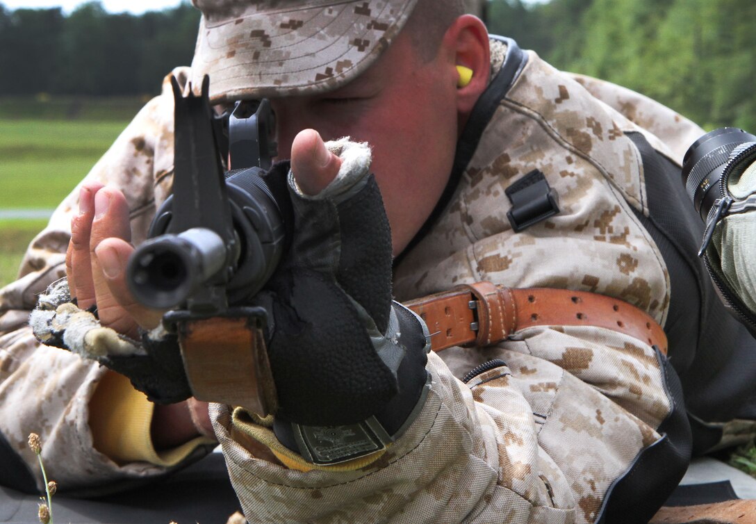 Cpl. Jared Litke, a member of the Marine Corps Shooting Team, gets ready to load a second magazine into his M16 national match rifle during a rapid fire session at the rifle range aboard Marine Corps Base Quantico, Va., July 14, 2010. The Marine Corps Shooting Team is made up of some of the Corps’ best shots and competes nationwide, as well as establishing a cadre of experienced marksmen to pass knowledge to the next generation of devil dogs.