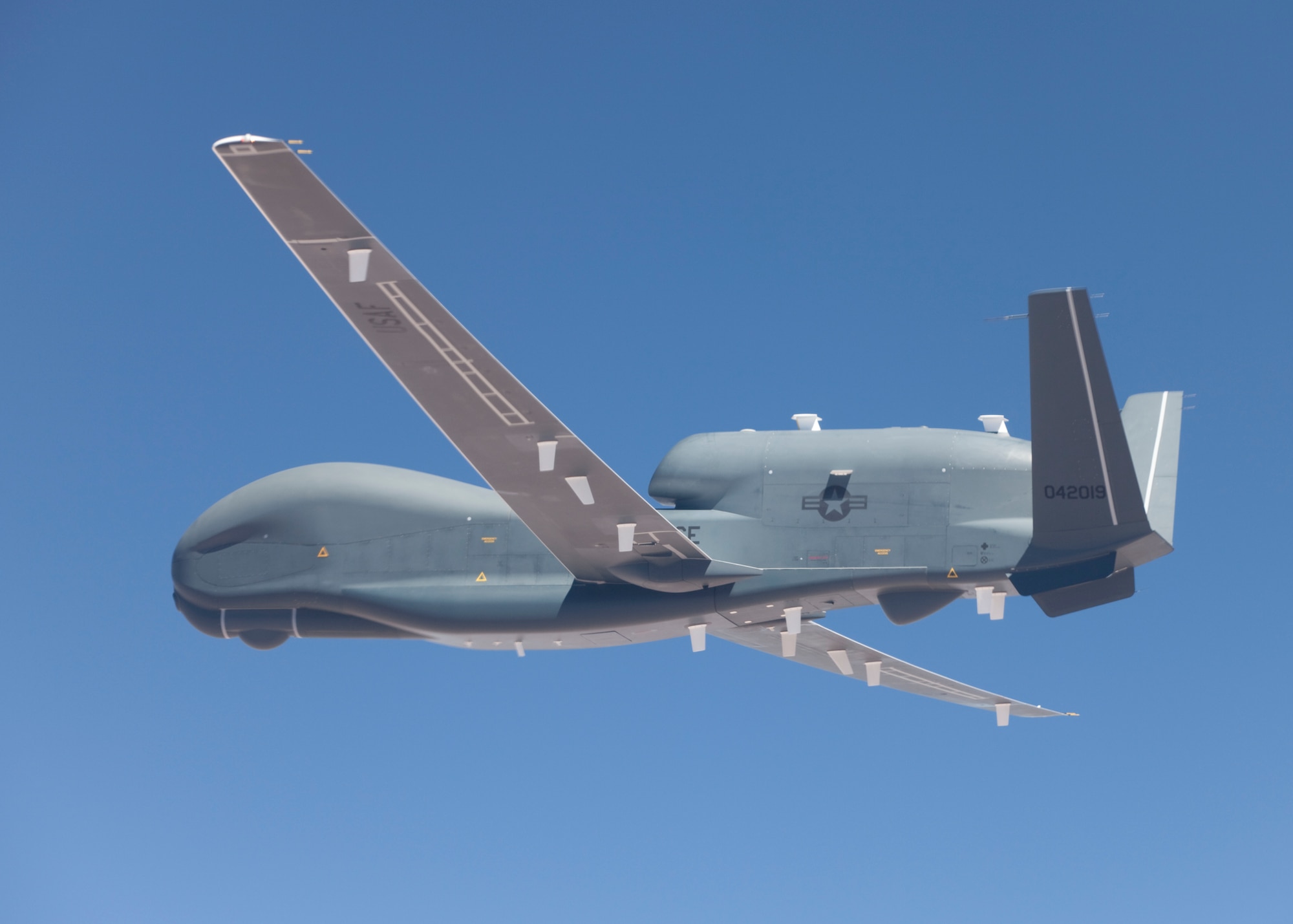 A BACN Global Hawk, one of two battlefield airborne command node unmanned aerial systems, took off from Northrop Grumman’s manufacturing facility in Palmdale, Calif., July 14. The aircraft made its first functional checkout flight after completing modifications to a communications platform. The functional checkout flight ended with a picture-perfect landing at Edwards. The Joint Urgent Warfighter Need program's purpose is to improve air and ground communications while on the battlefield. (Air Force photo by Greg L. Davis)
