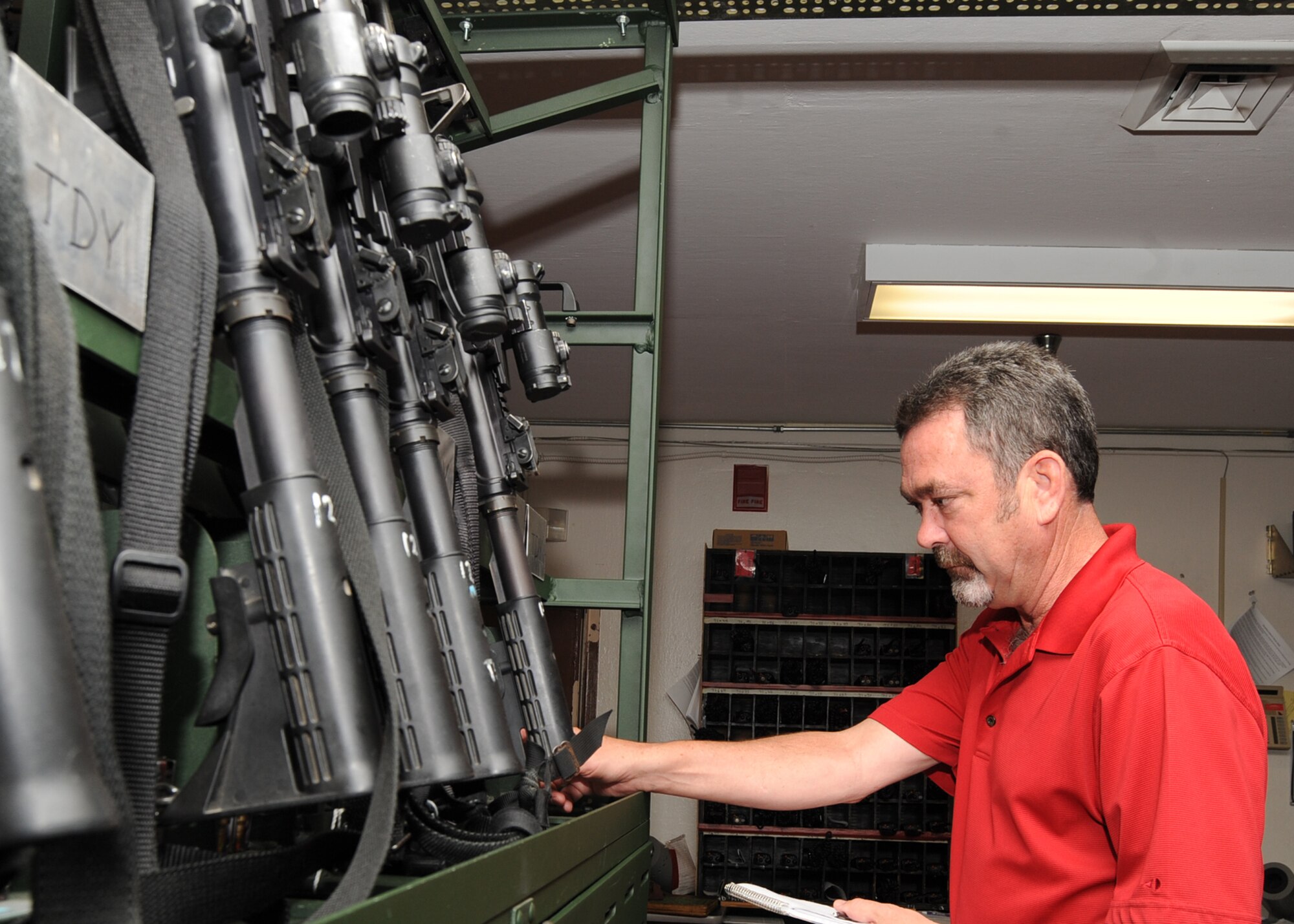 Donald Maher, 22nd Air Refueling Wing weapons safety manager, inspects weapons at the 22nd Security Forces Squadron armory June 16, 2010, McConnell Air Force Base, Kan.  Weapons safety personnel ensure unit weapons safety representatives take appropriate measures to minimize mishaps and eliminate safety violations.  Weapons safety personnel also ensure all personnel are properly trained before operating, handling, transporting, maintaining, loading or disposing of missiles, explosives and other weapons.  The wing weapons safety office must keep current records of the handling locations on McConnell.  (U.S. Air Force photo/ Senior Airman Maria Ruiz)