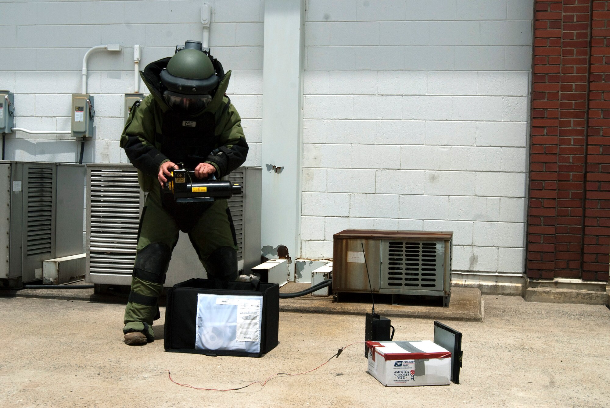 Staff Sgt. Wesley Kory wears a protective suit while digitally x-raying a suspicious package at Kunsan Air Base, South Korea, during exercise Beverly Bulldog 10-02 July 12, 2010. The digital x-ray system helps law enforcement, military, customs and security personnel search for explosives, weapons, narcotics and other contraband.  Sergeant Kory is an explosive ordnance technician with the 8th Civil Engineer Squadron.  (U.S. Air Force photo/Staff Sgt. Jonathan Pomeroy)
