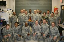 Reservists with the 916th Communication Squadron stand with Col. Randy Ogden, 916th commander, displaying their Unit Public Affairs Representative trophy. (USAF photo by Maj. Shannon Mann, 916ARW/PA)