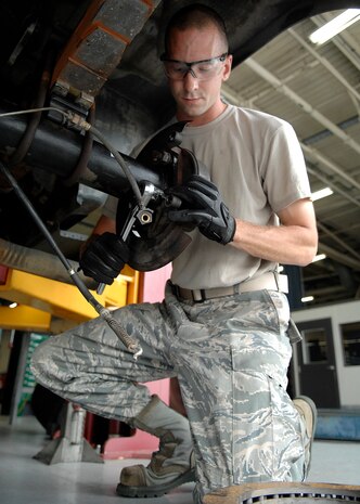 Airman 1st Class Jonathan Buncak secures an emergency brake assembly on a flightline tow truck at the vehicle maintenance shop July 14, 2010 on Joint Base Charleston, S.C. The vehicle maintenance shop processes and completes more than 1,500 repair jobs every month while performing repairs on location like the flightline and tire service center. Airman Buncak is a vehicle maintenance technician with the 628th Logistics Readiness Squadron. (U.S. Air Force photo/Senior Airman Timothy Taylor) 