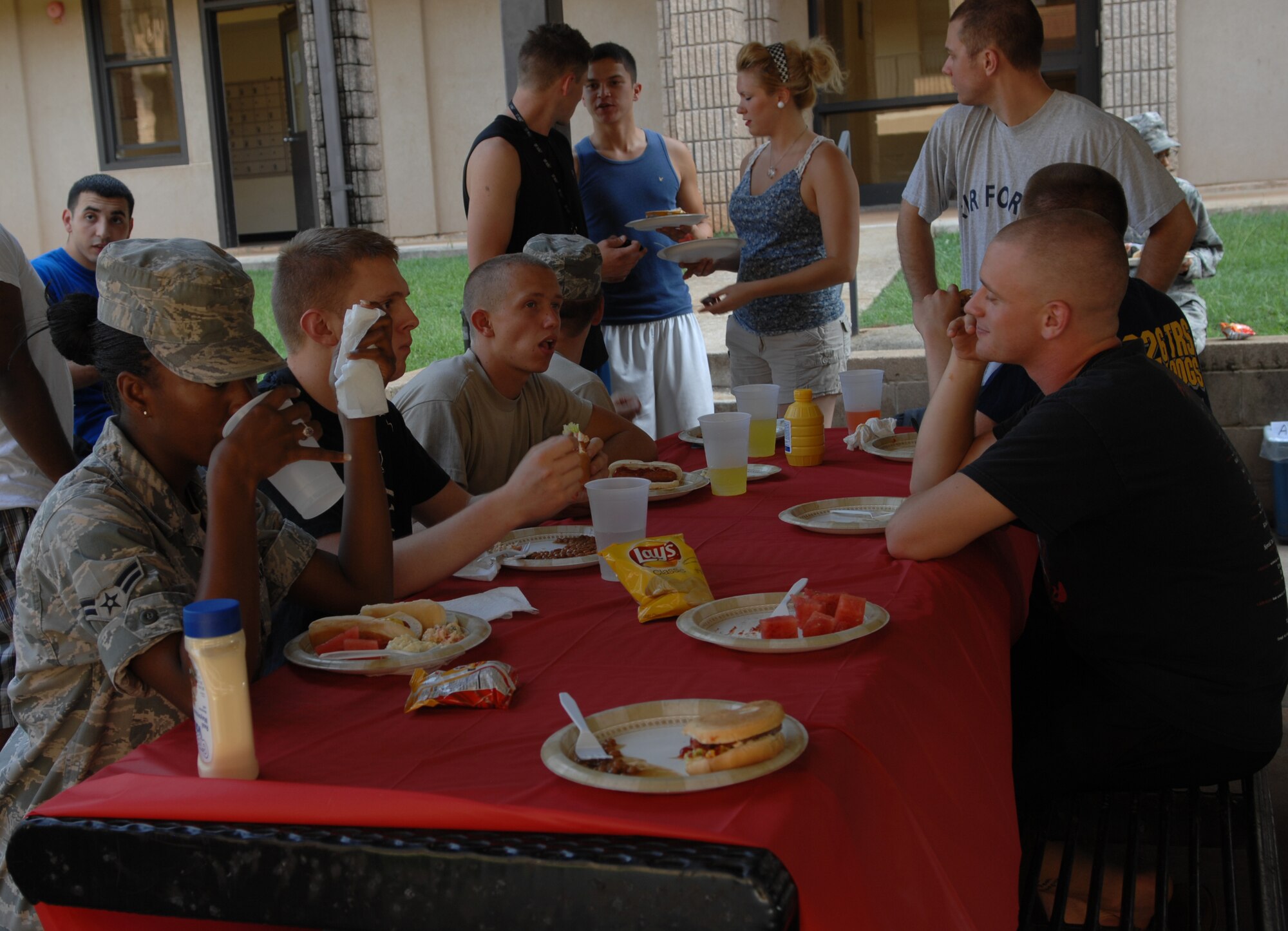 Airmen eat and socialize at the monthly dorm dinner here, July 13, 2010.  The dorm dinner is usually held the second Tuesday of each month. (U.S. Air Force photo/ Airman 1st Class Alexandria Mosness)