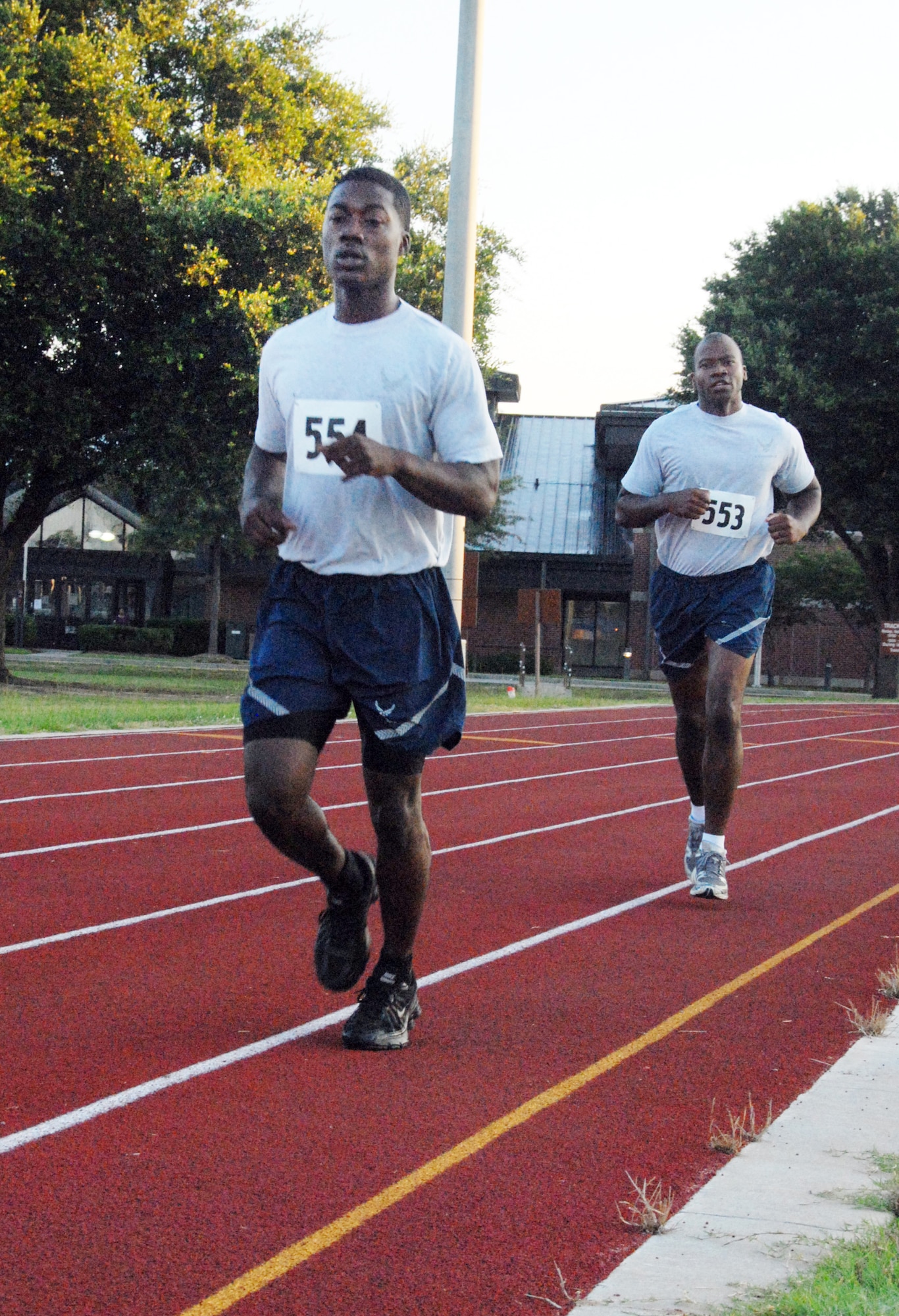 Two Robins Airmen complete the running segment of their test. U. S. Air Force photo by Wayne Crenshaw