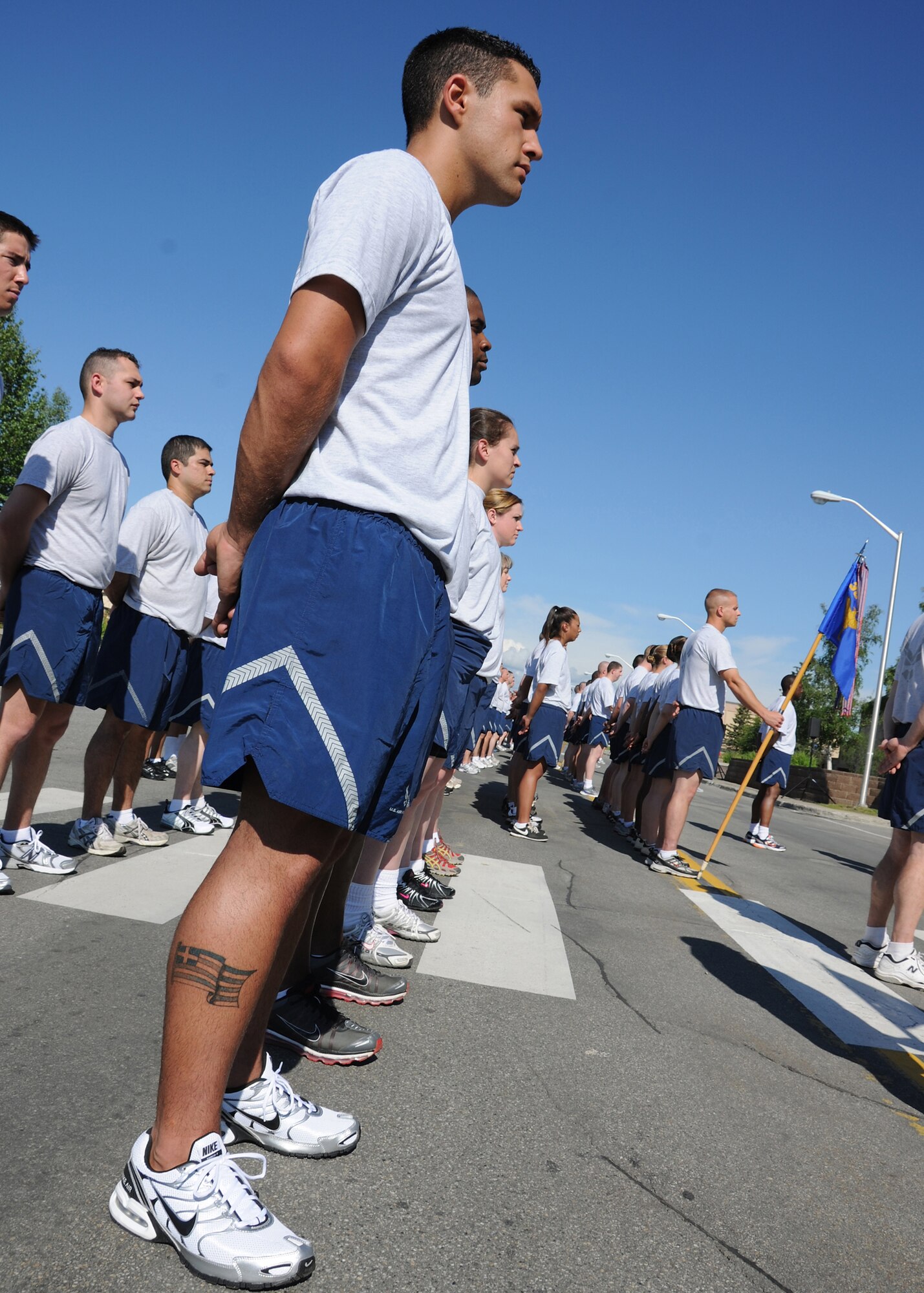 Airmen of the 354th Fighter Wing participate in retreat prior to a wing run on July 2, 2010 at Eielson Air Force Base, Alaska.  The Airmen gathered for the retreat ceremony and two-mile run to celebrate Independence Day.  (U.S. Air Force photo/Staff Sgt. Tia Wilson)