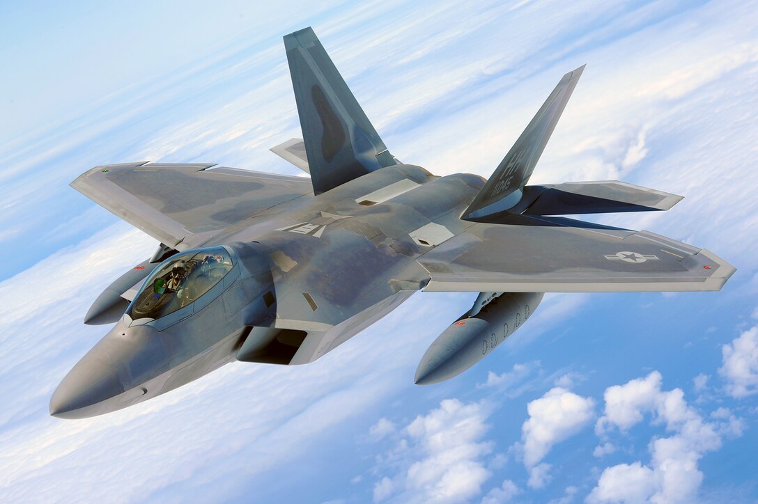 An F-22 Raptor soars through the air July 1, 2010, on its way home to Joint Base Pearl Harbor-Hickam, Hawaii. The first two F-22s, the U.S. Air Force's most advanced fighter jet, were dedicated July 9, 2010, at a ceremony here. (U.S. Air Force photo/Senior Airman Gustavo Gonzalez)