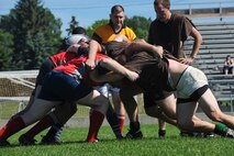 BISMARCK, N.D. -- The Minot and Bismarck team restart the game with a scrum at Hughes School Football Field here July 10. The Minot rugby team played against the Bismarck rugby team at the North Dakota Prairie State Games. Bismarck topped Minot 26-19. (U.S. Air Force photo by Senior Airman Ashley N. Avecilla)