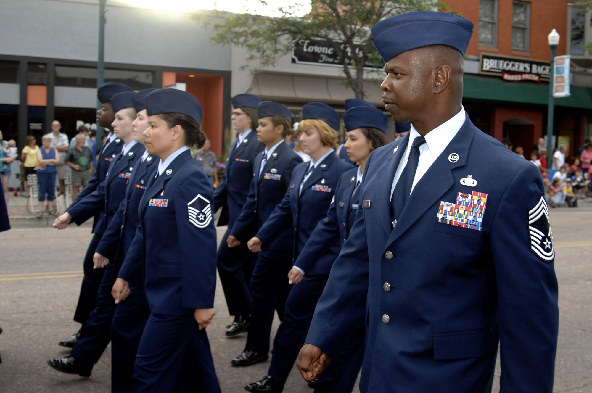 Chief Master Sgt. Stefney Dunson and other volunteers from the Air Force Academy march in the Pikes Peak or Bust Rodeo Parade in downtown Colorado Springs, Colo., July 13, 2010. Chief Dunson is superintendent of the Academy's 10th Air Base Wing, which supports the Academy mission through medical, engineering, logistics, communications, personnel, sercurity and force support services for more than 25,000 people. (U.S. Air Force photo/Mike Kaplan)