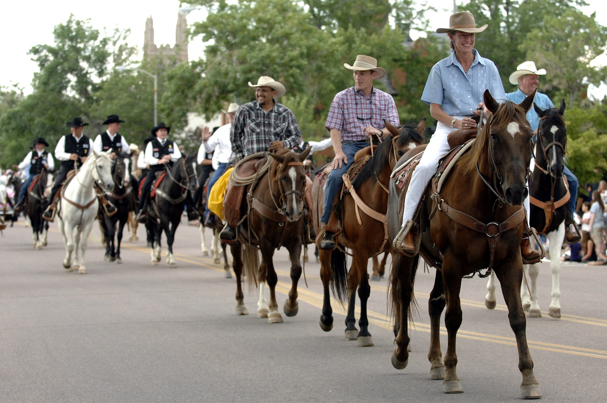 Brig. Gen. Dana Born and her husband, Tim, ride in the Pikes Peak or Bust Rodeo Parade in downtown Colorado Springs, Colo., July 13, 2010. General Born was grand marshal for the parade, which kicks off four days of rodeo action at the Norris-Penrose Event Center. Proceeds from the rodeo go back to local military installations. General Born is dean of the faculty at the U.S. Air Force Academy. (U.S. Air Force photo/Mike Kaplan)