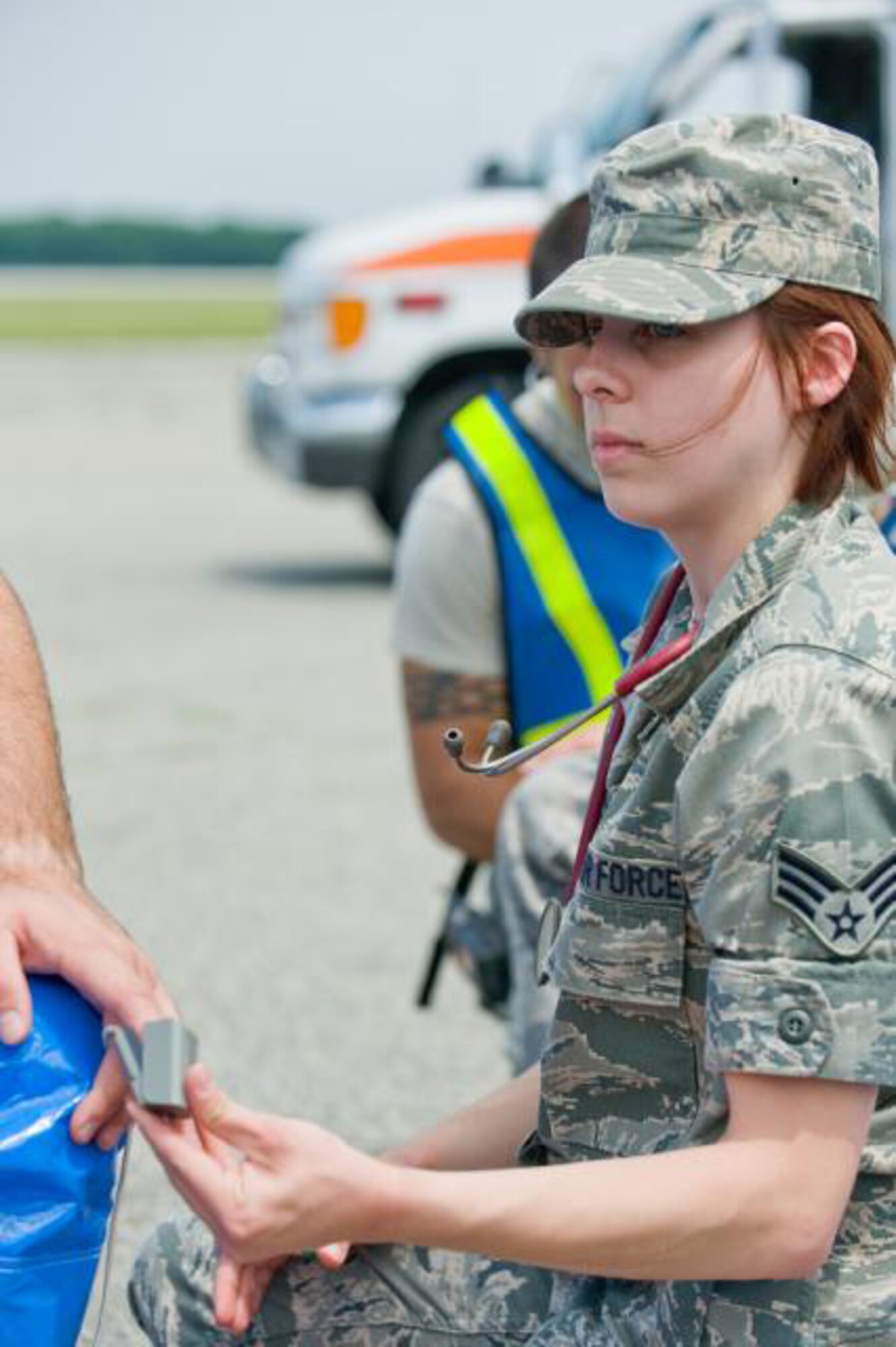 DOVER AIR FORCE BASE, Del.- Senior Airman Laura Rosebrooks, a Reserve medical technician with the 512th Aerospace Medical Squadron here, takes the pulse of a mock patient using a finger pulse oximeter during an exercise here, July 10. The oximeter can be used during critical and intensive care, surgery, and post-operative care during recovery. Airman Rosebrooks recently finished a volunteer assignment here supporting the Operation Enduring Freedom troop-build up. (U.S. Air Force photo/Roland Balik)