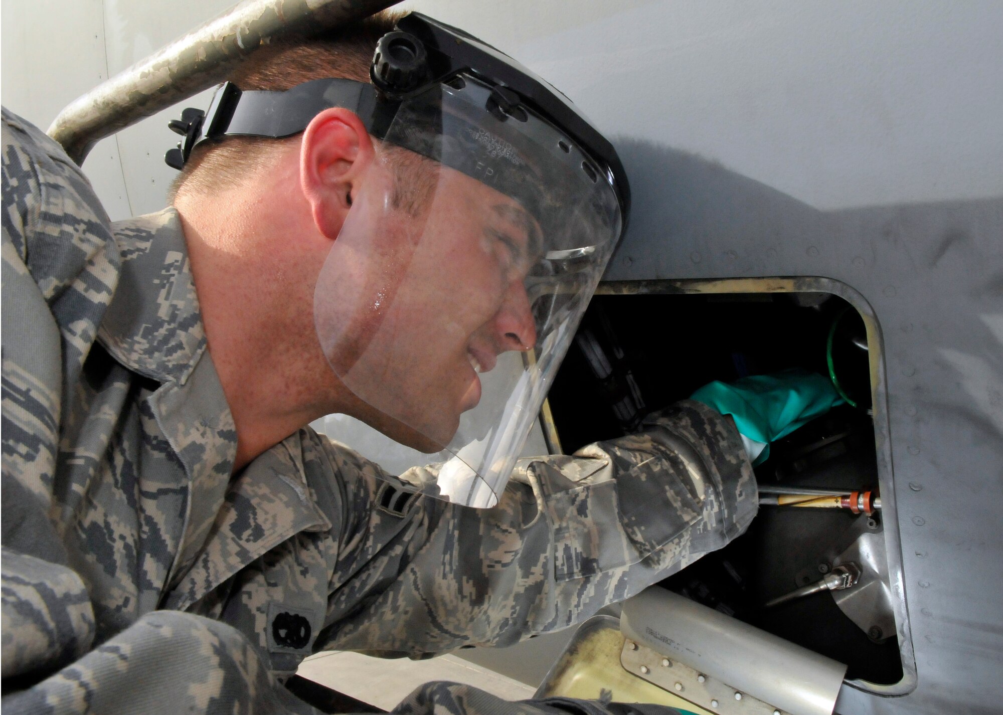 Airman 1st Class David Reynolds, 521st Air Mobility Operations Group, Detachment 5 electro-environmental systems apprentice, checks the oil on engine number one of a C-17 Globemaster III July 12, 2010, Joint base Balad, Iraq. Unlike fighter aircraft that are close to the ground, the C-17’s engine is set approximately 10 feet of the ground, requiring the use of a maintenance stand to gain access. Airman Reynolds, a native of Huntley, Ill., deployed from Joint Base McGuire-Dix-Lakehurst, N.J. (U.S. Air Force photo/Staff Sgt. Phillip Butterfield)