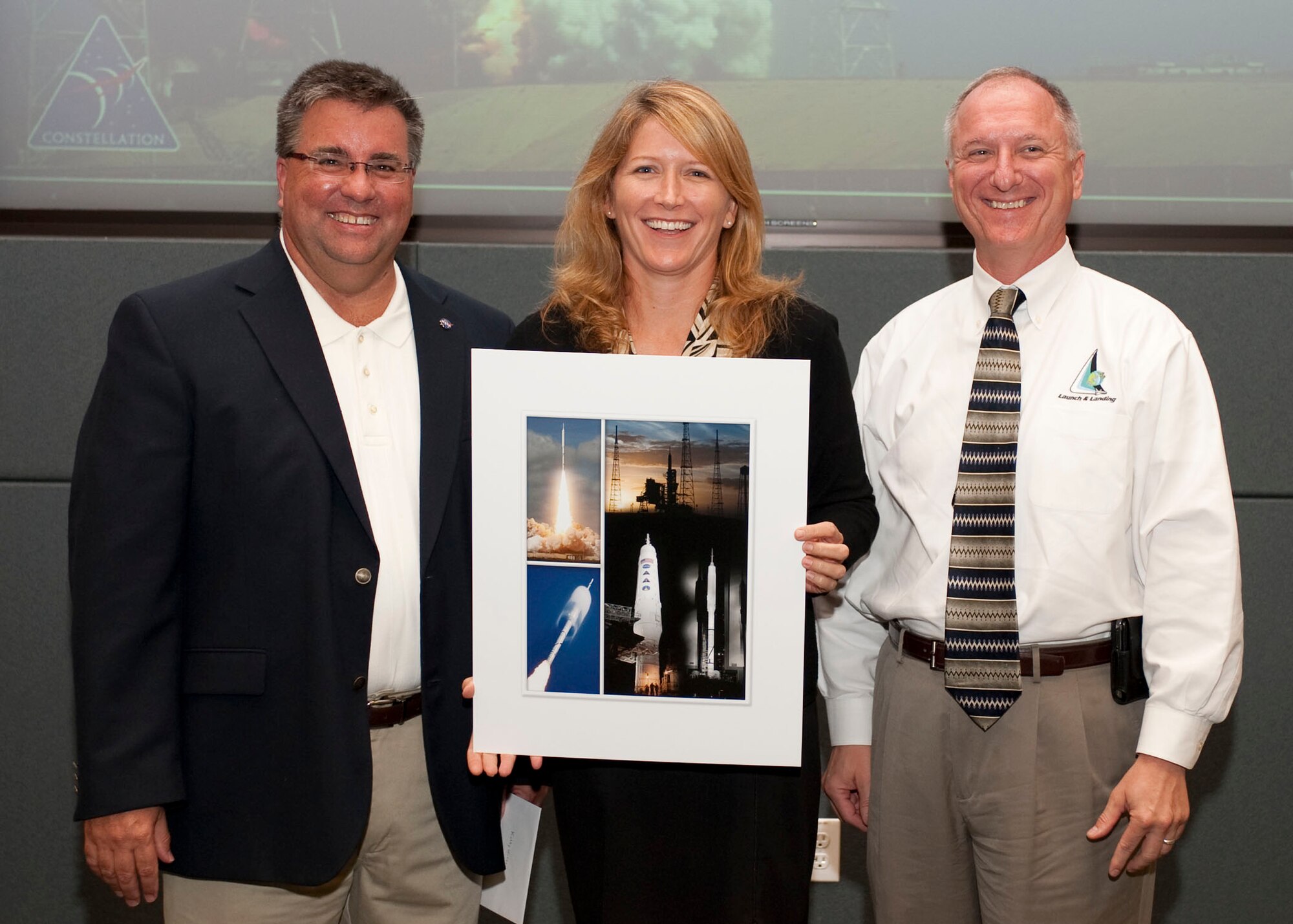 Mr. Ed Mango (left), Launch Director for NASA’s Ares I-X, and Mr. Pete Nickolenko (right), Acting Director Launch Vehicle Processing, recognized Ms. Kathy Winters of the 45th Space Wing Weather Squadron on July 1 with a NASA Launch Director’s Award for her outstanding support of the Ares I-X mission at Kennedy Space Center  “Kathy has always been a phenomenal partner with NASA, so it's great to see them recognize her contributions,” said Lt. Col. Todd Ellison, 45th SW Operations Group deputy commander. 