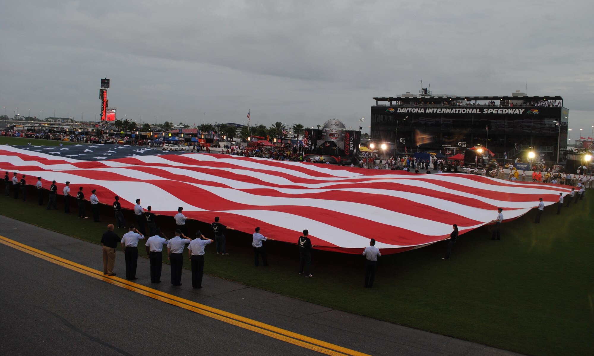 Over 120 Patrick AFB Airmen and delayed enlisted members unfurled a football-field-size American flag at the Coke-Zero 400 race at Daytona International Speedway July 3 during the pre-race festivities.  Gen. C. Robert Kehler, Air Force Space Command commander, was in attendance and helped swear in over 60 future Airmen on the track prior to the race.  The pre-race activities served as a tremendous lead up event for Air Force Week Cocoa Beech which will officially kickoff in late October.  