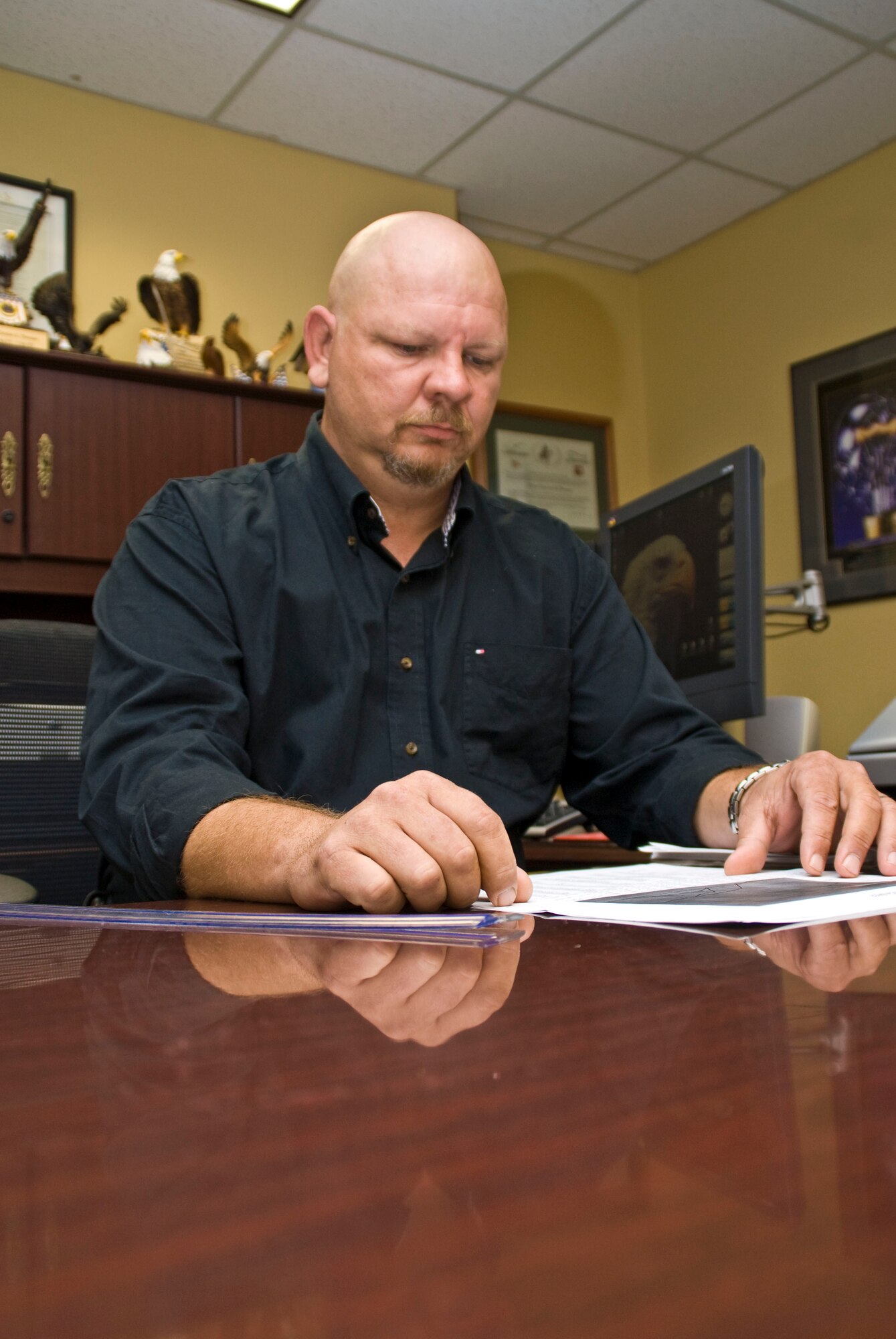 Terry Thomas, 19th Mission Support Group resource advisor, looks over a group spend plan July 13. Because of Mr. Thomas’s work, the wing obtained $1 million in Global War on Terror funds for deployments and training, ensuring Airmen were war ready . (U.S. Air Force photo by Staff Sgt. Nestor Cruz)