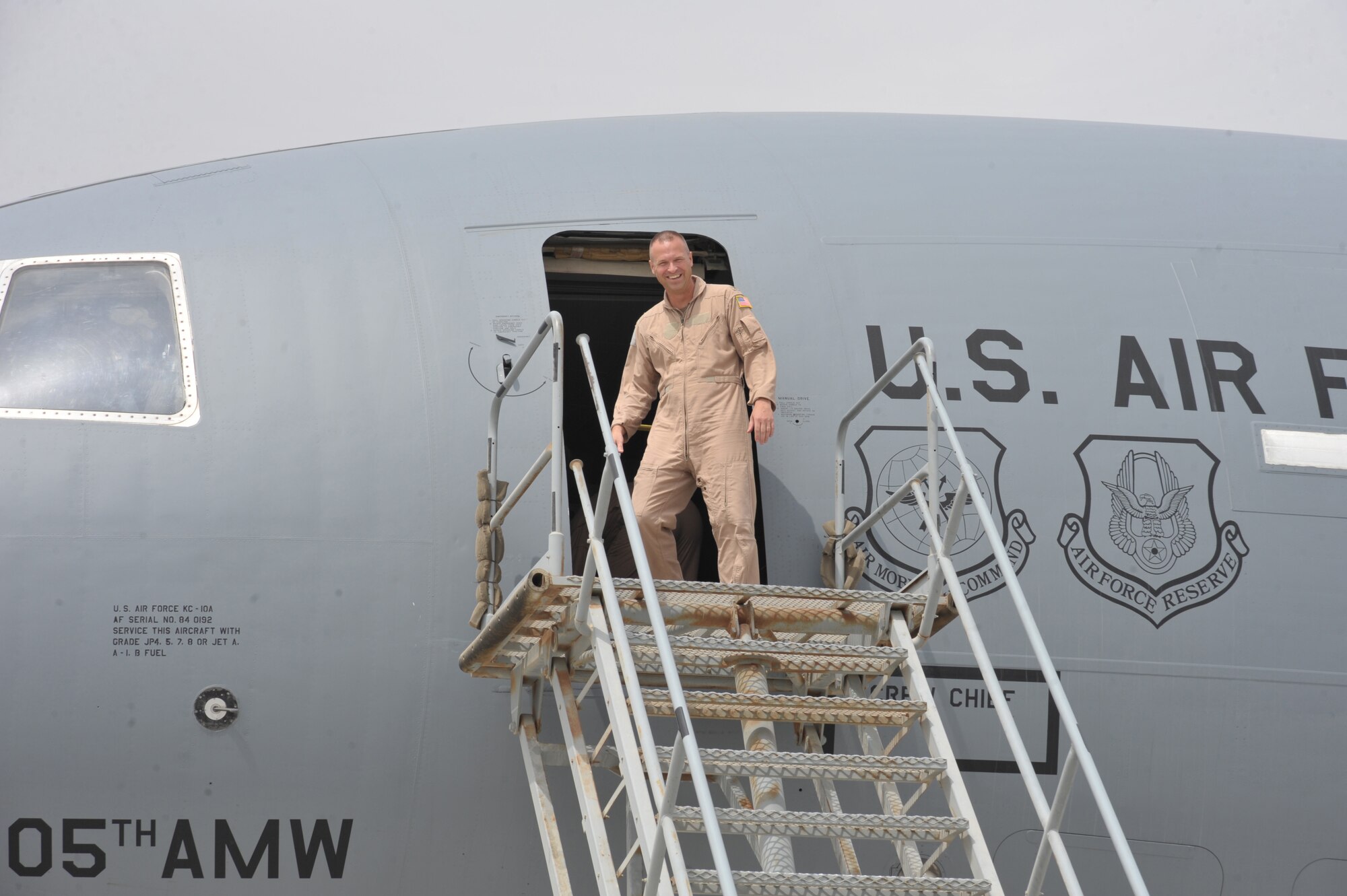 Col. Kip Turain, 380th Air Expeditionary Wing vice commander, steps off the flight deck of an KC-10 Extender after his fini flight July 13 at an undisclosed location in Southwest Asia. (U.S. Air Force Photo/Tech Sgt April Wickes )