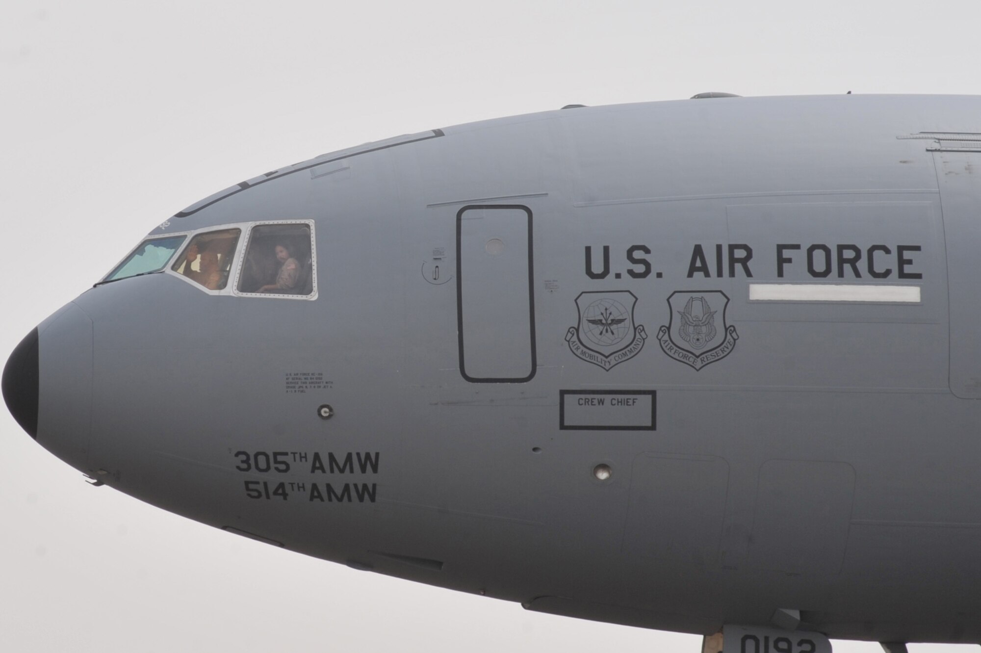 Col. Kip Turain, 380th Air Expeditionary Wing vice commander, waves from the flight deck of an KC-10 Extender after his fini flight July 13 at an undisclosed location in Southwest Asia.  (U.S. Air Force Photo/Tech Sgt April Wickes )