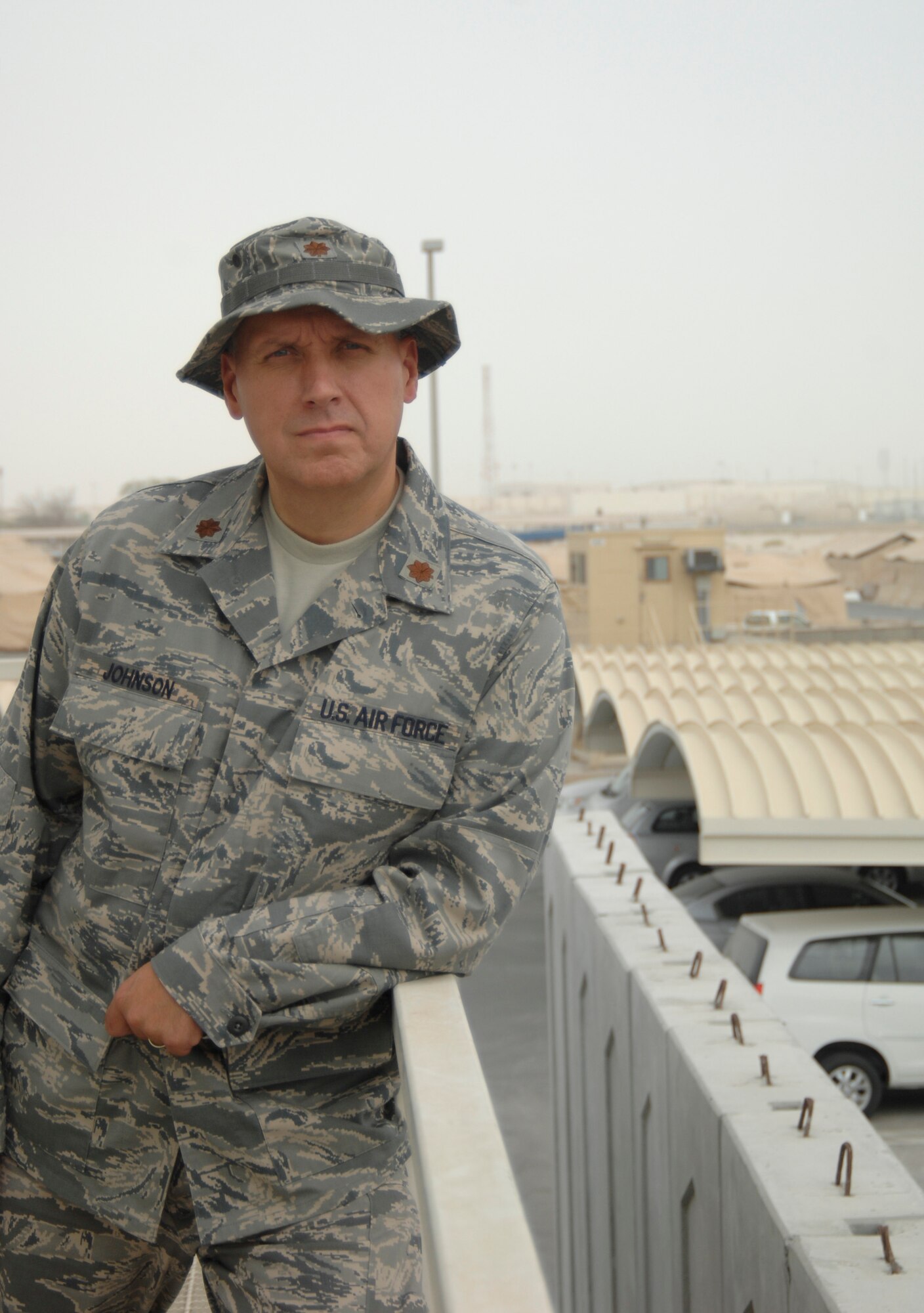 Maj. (Dr.) Ron Johnson , of mental health services at the 380th Expeditionary Medical Group, poses outside his office at a non-disclosed base in Southwest Asia, July 14, 2010. (U.S. Air Force Photo/Staff Sgt. Jeremy Larlee/released)