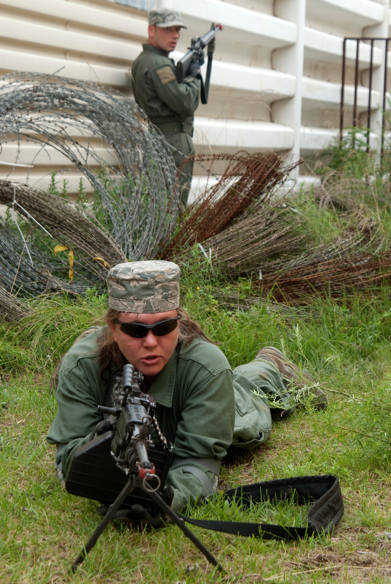 KUNSAN AIR BASE, Republic of Korea – Aggressors keep watch after taking out several defenders after assaulting the 8th Communications Squadron compound while participating in a ground attack scenario during exercise Beverly Bulldog 10-2 July 14.  The attack was meant to test the readiness and operational awareness of security forces personnel and augmentees. (U.S. Air Force photo/Staff Sgt. Jonathan Pomeroy)