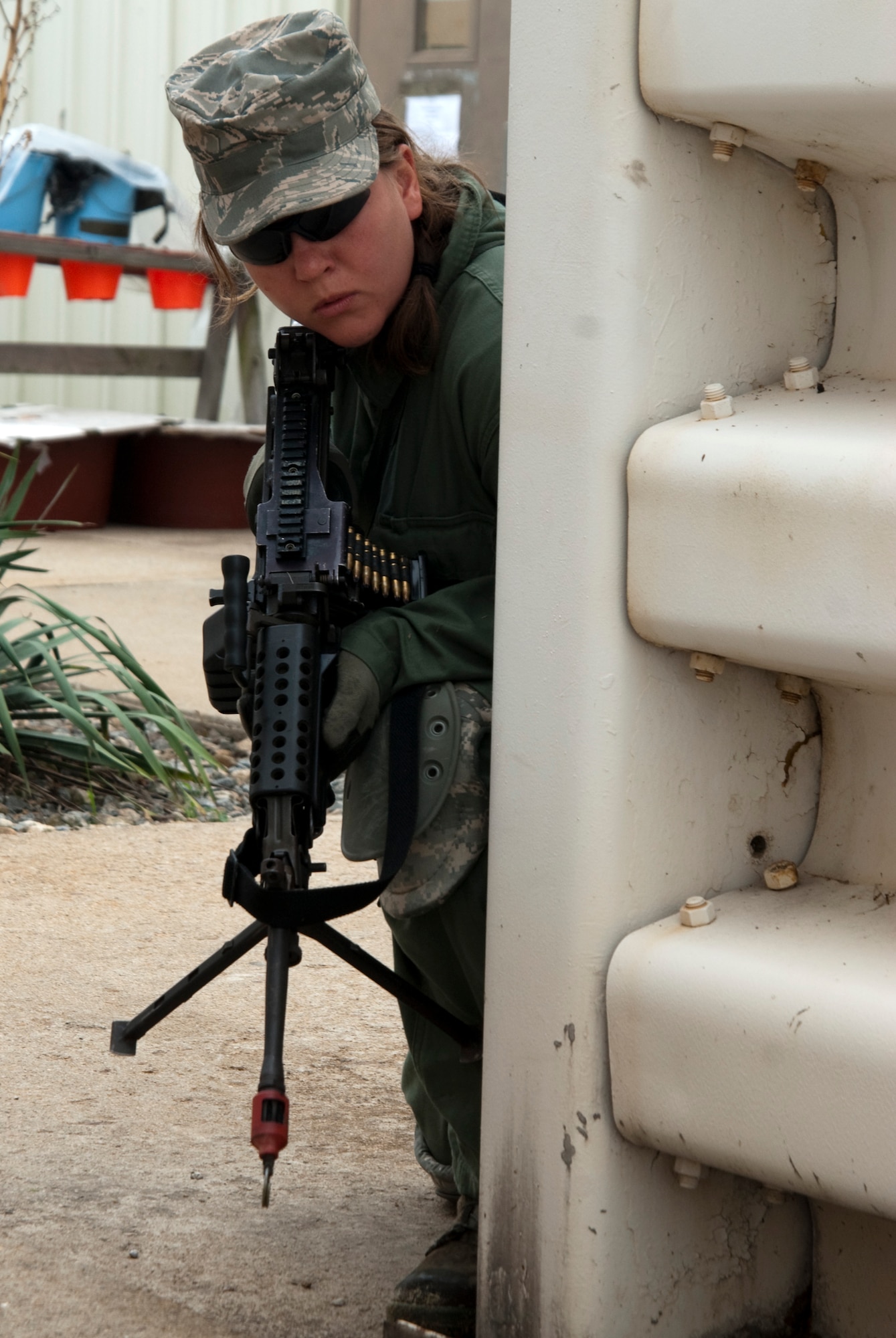 KUNSAN AIR BASE, Republic of Korea – An aggressor takes a defensive position during a ground attack scenario in the 8th Communications Squadron compound during exercise Beverly Bulldog 10-2 July 14.  The attack was meant to test the readiness and operational awareness of security forces personnel and augmentees. (U.S. Air Force photo/Staff Sgt. Jonathan Pomeroy)