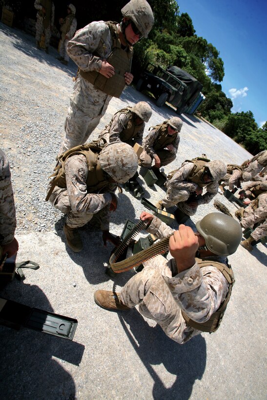 Sgt. Edwin Santos, an administrative clerk with Marine Forces Reserve Headquarters, wipes graffiti off a public sign in the French Quarter area of New Orleans June 14, 2010.  Santos and a group of Marines volunteered to help Vieux Carre Graffiti Abatement Program with cleaning up graffiti on public property in the French Quarter.  VC-GAP assembled approximately 50 volunteers to help with removing graffiti from the area.  The volunteers split into groups and headed to assigned areas to clean the graffiti.  VC-GAP wants to protect historic areas in the community.