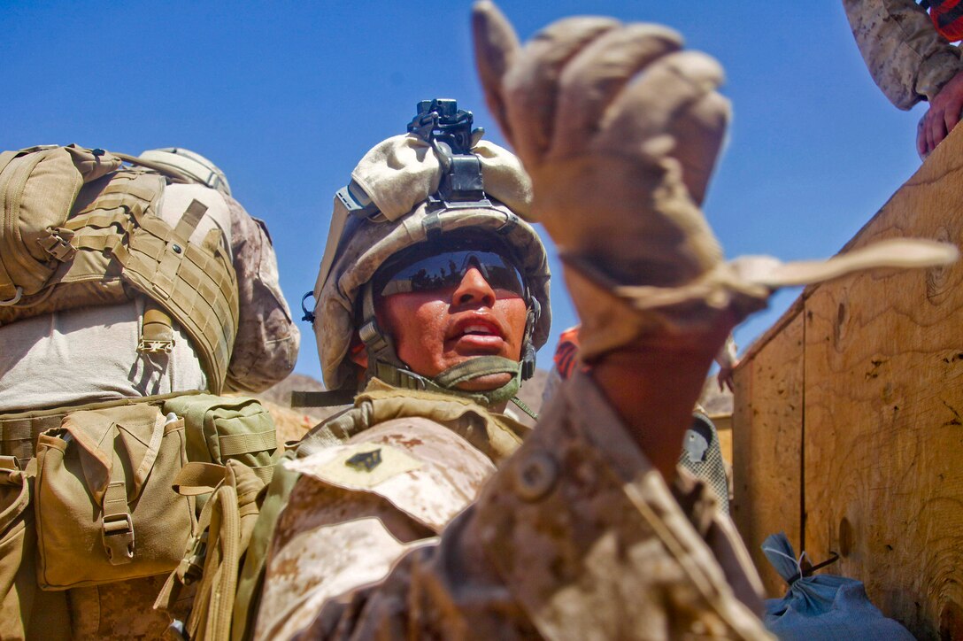 Sgt. D.B. Castillo, India Company, 3rd Battalion, 5th Marine Regiment, instructs his Marines to continue fire suppression fire at Range 410 on July 14 during training exercise Enhanced Mojave Viper. Range 410 utilizes different styles of tactical and technical procedures during a platoon-sized attack. Enhanced Mojave Viper is a combined arms exercise that prepares Marines for deployment to Afghanistan.