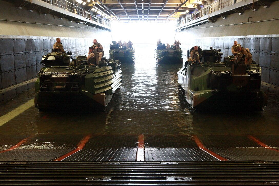 U.S. Marines from Alpha Company, 2nd Amphibious Assault Vehicles, attached to Special-Purpose Marine Air-Ground Task Force Continuing Promise 2010, proceed en route to the well deck of the USS Iwo Jima on July 15, 2010. Marines and Sailors are deploying in support of Operation Continuing Promise 2010 to provide humanitarian assistance and disaster relief to Caribbean, Central and South America.
