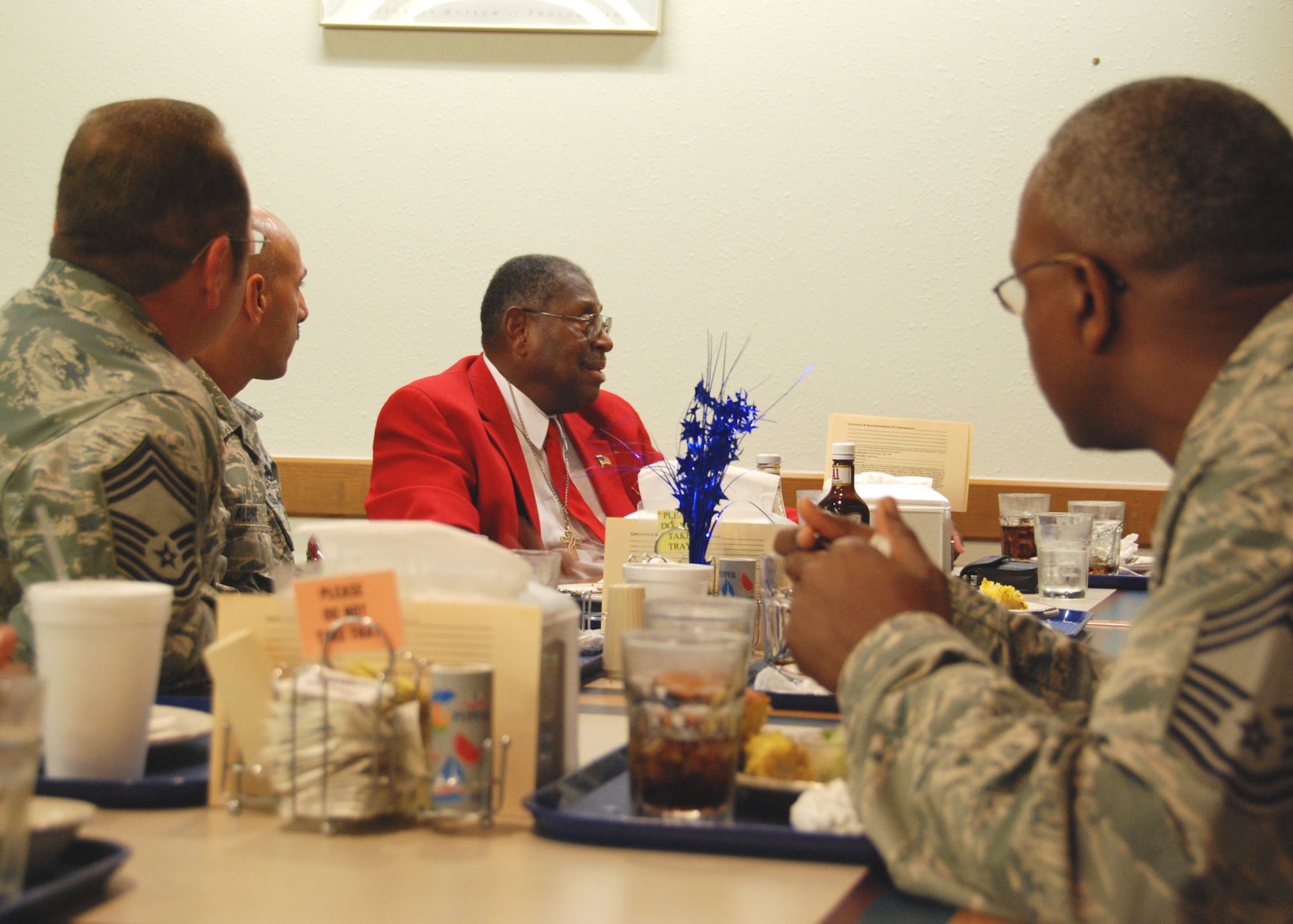 Retired Chief Master Sgt. Walter Richardson talks with members of Duke Field’s Chiefs Group during lunch at the base dining facility July 10.  An original member of the famed World War II-era Tuskegee Airmen, the 30-year veteran later spoke to a mass audience of 919th Special Operations Wing reservists about his role as one of the first African-American Airmen tasked to begin integrating the fledgling U.S. Air Force.  (U.S. Air Force photo/Tech. Sgt. Cheryl Foster)