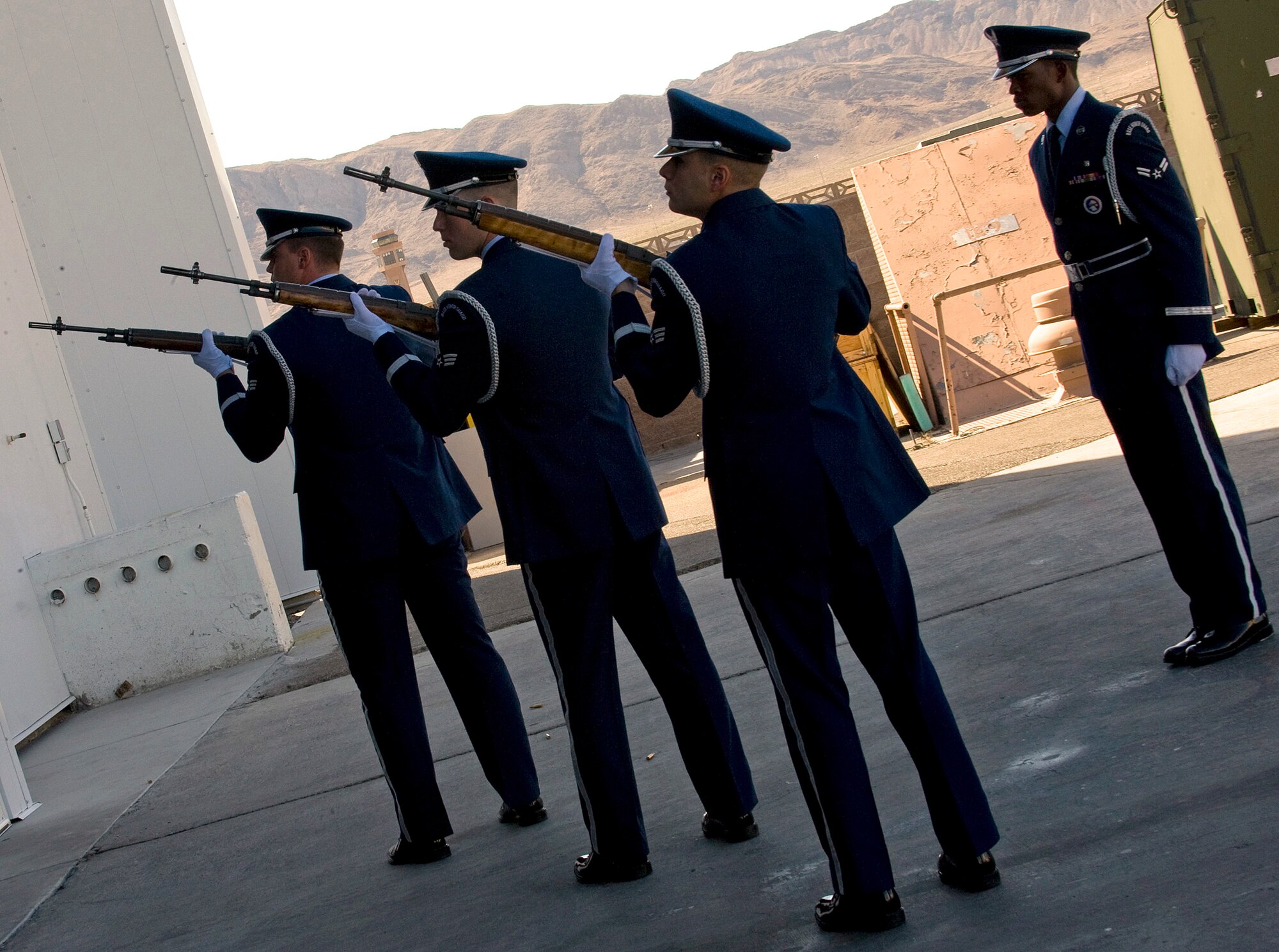 NELLIS AIR FORCE BASE, Nev. --   A Nellis Air Force Base Honor Guard firing party, fires a volley in honor Capt. David Wisniewski, an HH-60G helicopter pilot assigned to the 66th Rescue Squadron, during a memorial service at Nellis Air Force Base July 15. Captain Wisniewski, 31, passed away at the National Naval Medical Center in Bethesda, Md., July 2 from injuries received when an HH-60G Pave Hawk helicopter crashed in southeastern Afghanistan June 9. Four other Airmen killed and two others were wounded during the incident. (U.S. Air Force Photo by Airman 1st Class Brett Clashman)

