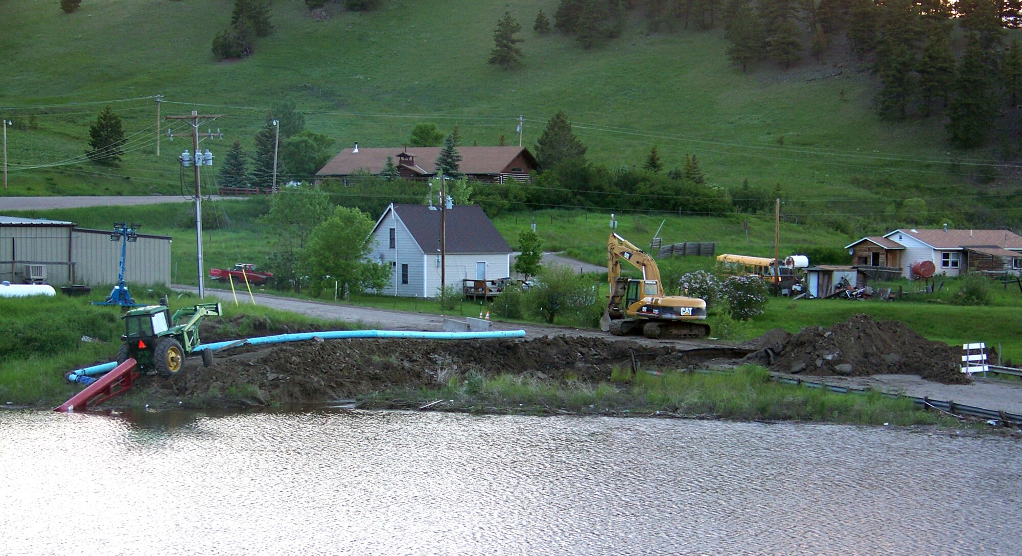Flash floods washed out roads, such as the one pictured here, at the Rocky Boy Indian Reservation in Montana in June.  Reservists from the 446th Aerospace Medicine Squadron, Joint Base Lewis-McChord, Wash.,  arrived the day before the floods, which damaged the tribe's clinic, for a routine medical training and support mission. (Courtesy photo)