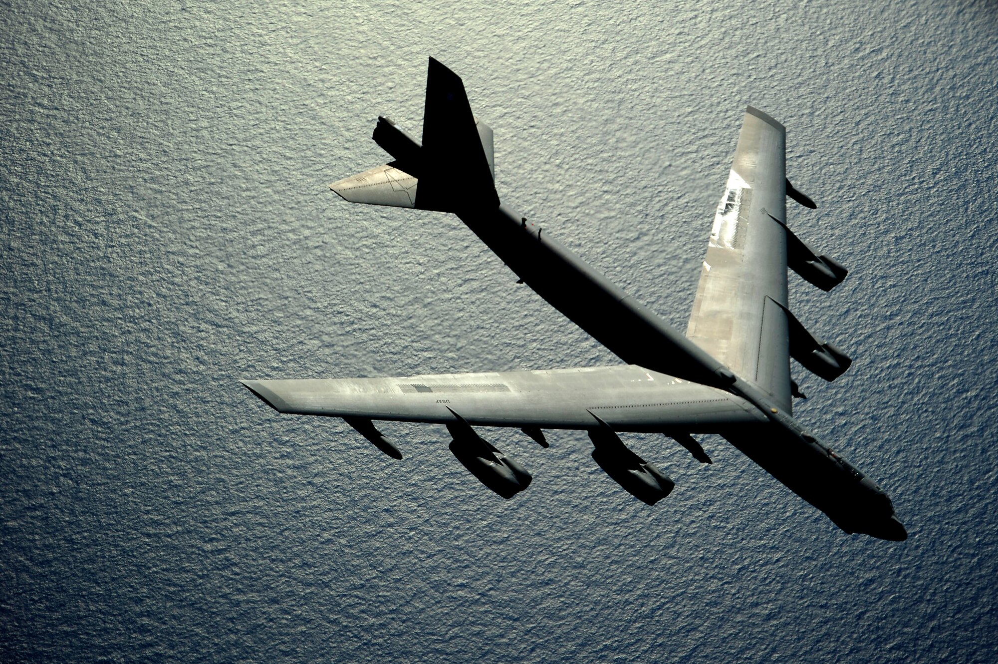 A B-52 Stratofortress flies over the Pacific Ocean after an air refueling during the Rim of the Pacific exercise July 10, 2010. RIMPAC is a biennial, multinational exercise designed to strengthen regional partnerships and improve interoperability. The B-52 is from the 20th Bomb Squadron at Barksdale Air Force Base, La. (U.S. Air Force photo/Staff Sgt. Kamaile O. Long)
