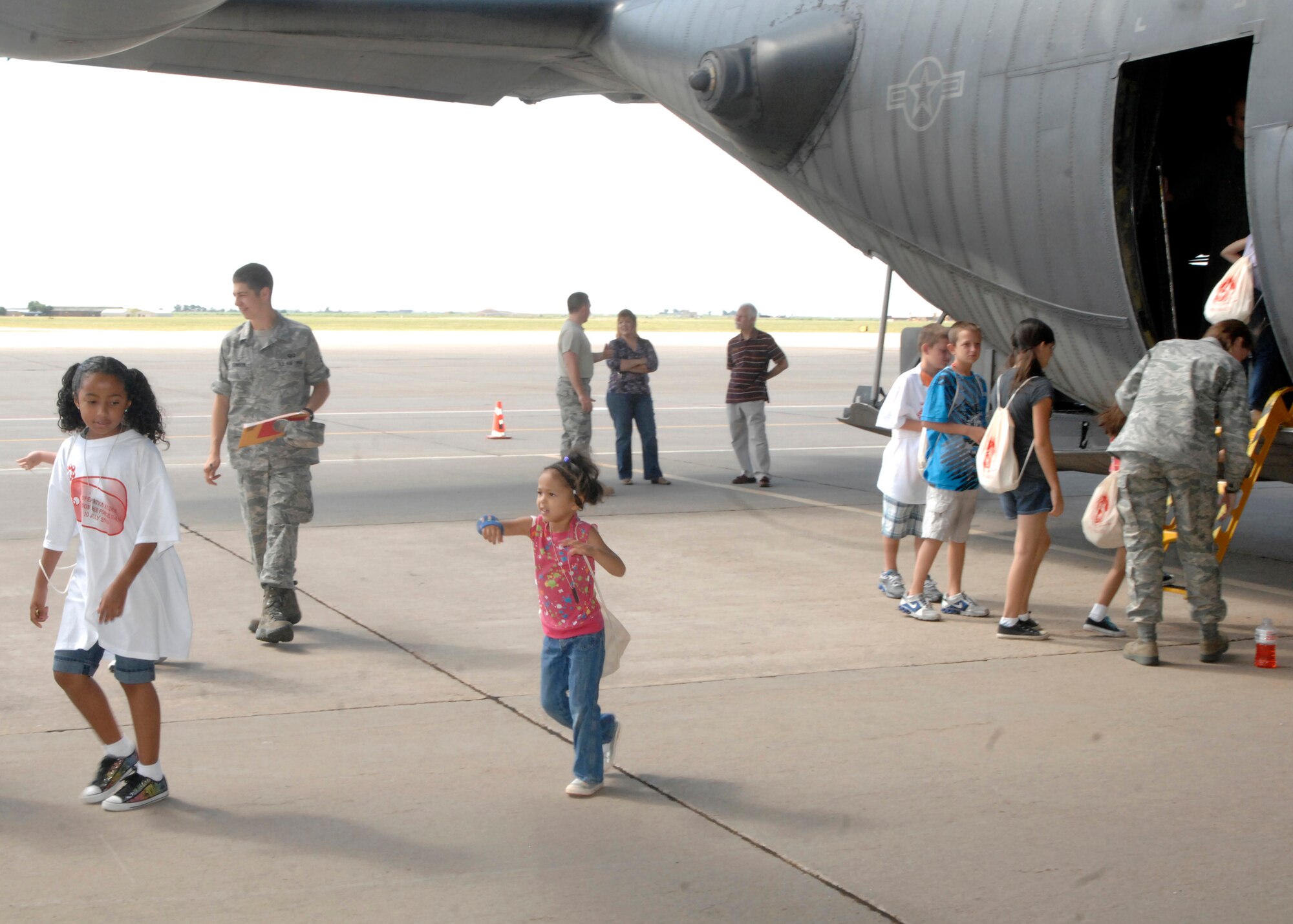 Children get to see what the inside of an AC-130H Spectre gunship looks like during Operation KUDOS, or Kids Understanding Deployment Operations, July 10, 2010. The event at Cannon Air Force Base, N.M., was designed to give them a better understanding of what mom and dad, assigned to the 27th Special Operations Wing, undergo during a deployment. (U.S. Air Force photo by Greg Allen) (RELEASED) 