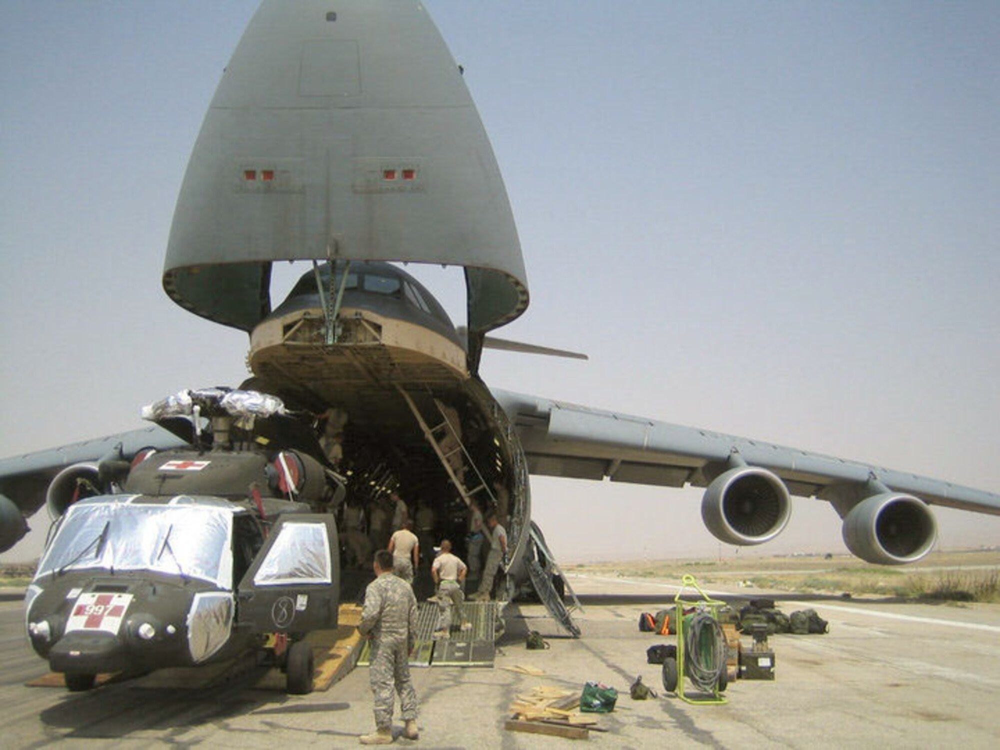 C-5 aircrews from the Air Force Reserve's 709th Airlift Squadron and the active Air Force's 9th AS at Dover Air Force Base, Del., spent June 15, 2010 through July 15, 2010 overseas supporting the troop surge by delivering 4 million pounds of cargo to various locations in Afghanistan. (Courtesy photo)