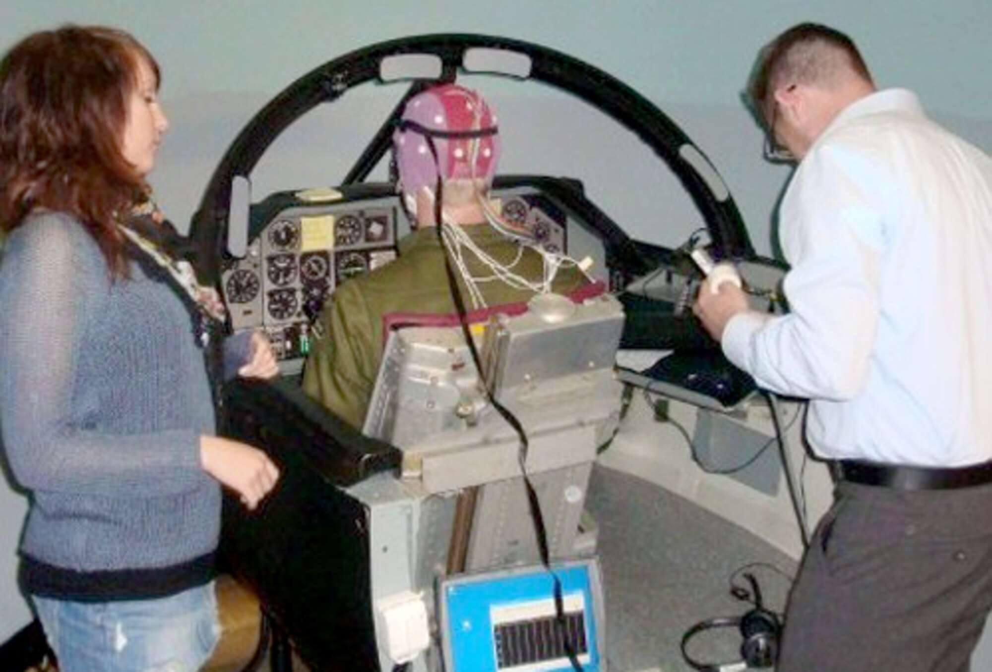 Lab technicians analyze data from a human-machine coupling interface. (Courtesy photo)