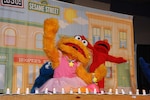 Zoe dances during the Sesame Street Experience July 8. The USO sponsored four permances of the show which addressed difficult issues faced by military families. (U.S. Air Force photo/Alan Boedeker)