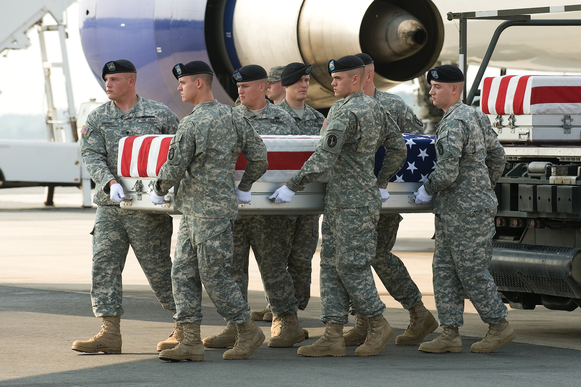 7 July 2010  USAF Photo by Jason Minto.  A U.S. Army carry team transfers the remains of Army SPC Louis R. Fastuca of West Chester, PA at Dover Air Force Base, Del., July 7, 2010.  