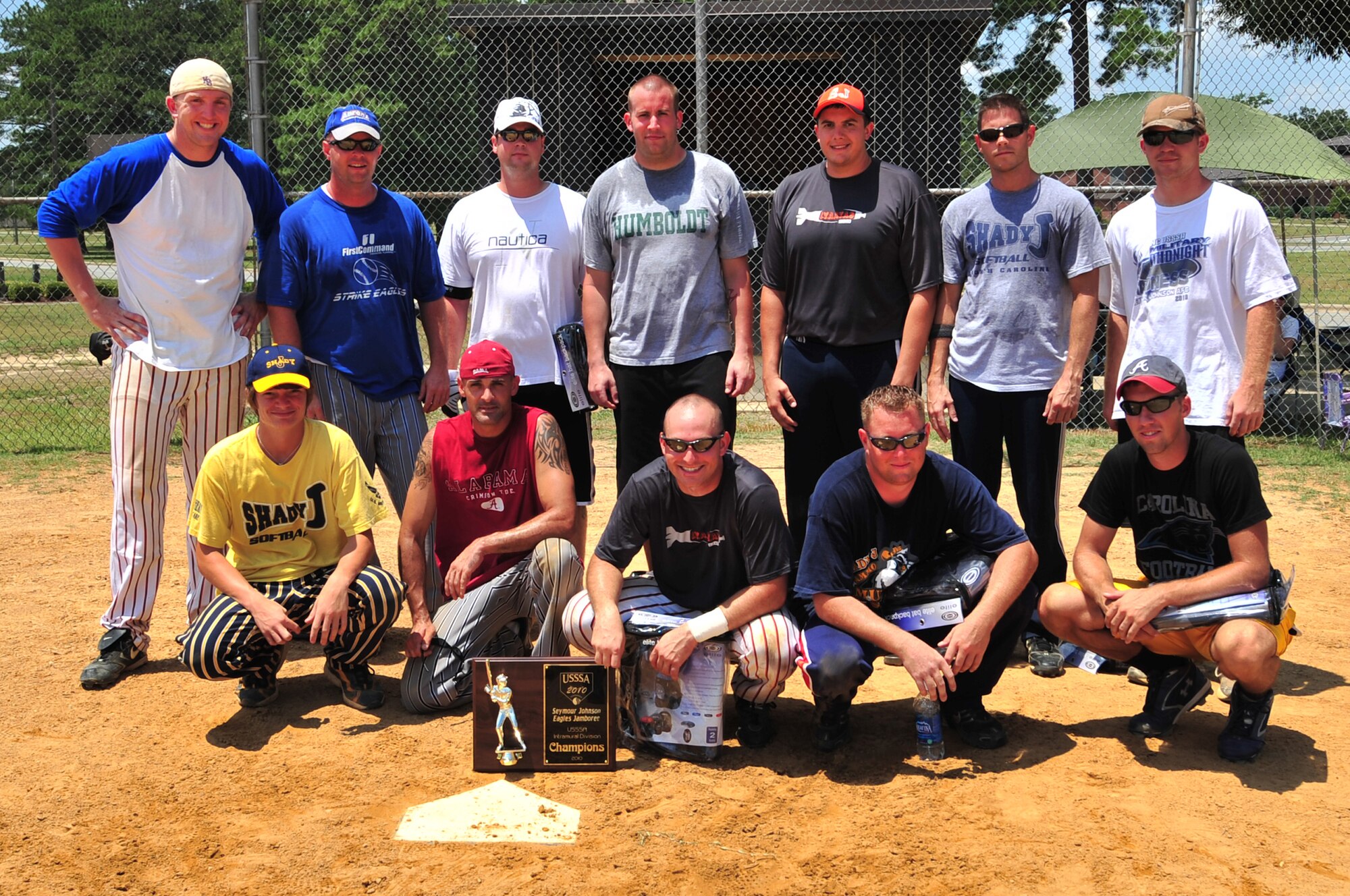 SEYMOUR JOHNSON AIR FORCE BASE, N.C. ? The Misfits, a Seymour Johnson Air Force Base intramural softball team, pose with the Eagles Grand Slam Jamboree Softball Tournament Championship trophy here June 11, 2010. Airmen from the 4th Equipment Maintenance Squadron, 4th Security Forces Squadron and dependents formed the winning team. (U.S. Air Force photo/Senior Airman Rae Perry)
