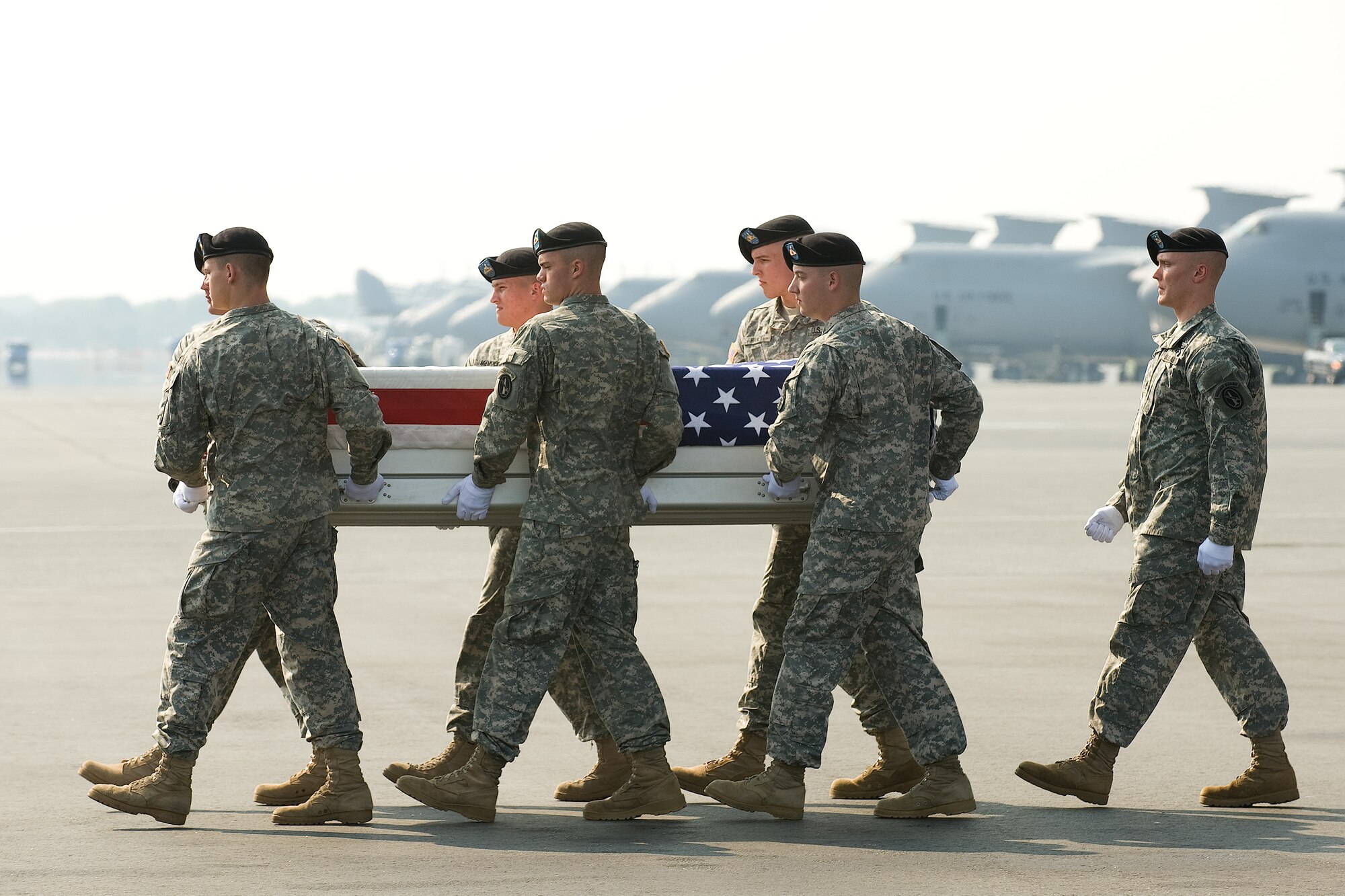 7 July 2010  USAF Photo by Jason Minto.  A U.S. Army carry team transfers the remains of Army SPC Jerod H. Osborne of Royse City, TX at Dover Air Force Base, Del., July 7, 2010.  