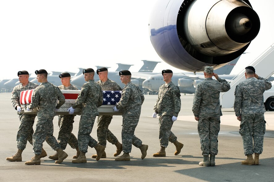 7 July 2010  USAF Photo by Jason Minto.  A U.S. Army carry team transfers the remains of Army SPC Keenan A. Cooper of Wahpeton, ND at Dover Air Force Base, Del., July 7, 2010.  